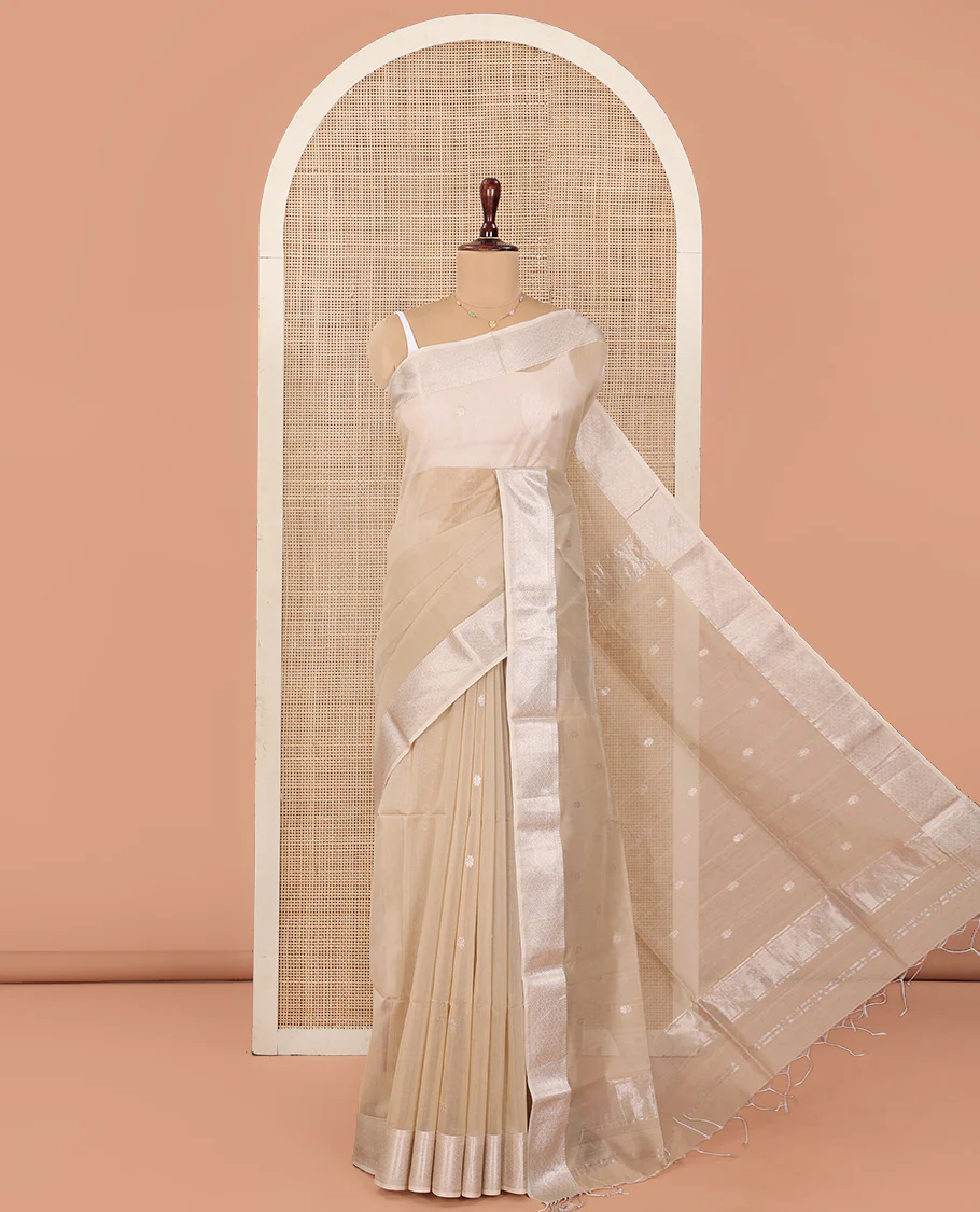 Beige Maheshwari Cotton Saree, Detailed with Flower Buttas All Over Its Body, Highlighted by Traditional Zari Design Border, Pallu Steeped with Flower Buttas, and Paired with a Matching Blouse