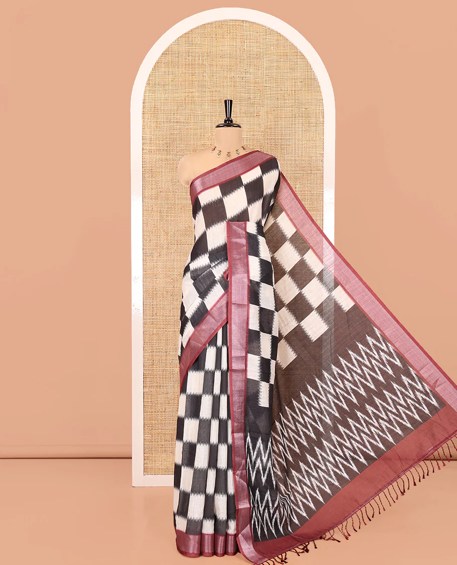 Black and White Linen Cotton Saree, Uniquely Printed with Chess-Style Checked Design on Its Body, Complemented by a Contrast Zari Border, Chevron Design Pallu, and Paired with a Contrast Blouse