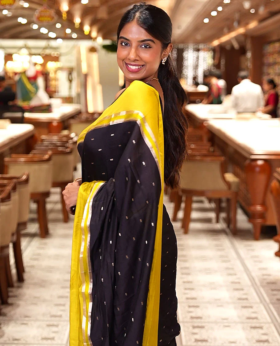Black Assam Silk Saree, Ornamented with Zari Buttas on Its Body, Complemented by Contrast Zari Striped Border, Pallu Steeped with Gleaming Zari Stripes and Buttas, and Paired with a Contrast Blouse - Image 3