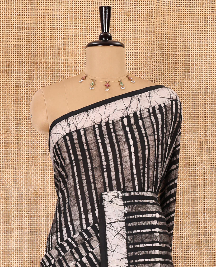 Black batik vertical stripes printed mul cotton saree, batik printed border, pallu of multi-color circle design, and a contrast batik printed blouse - Image 3