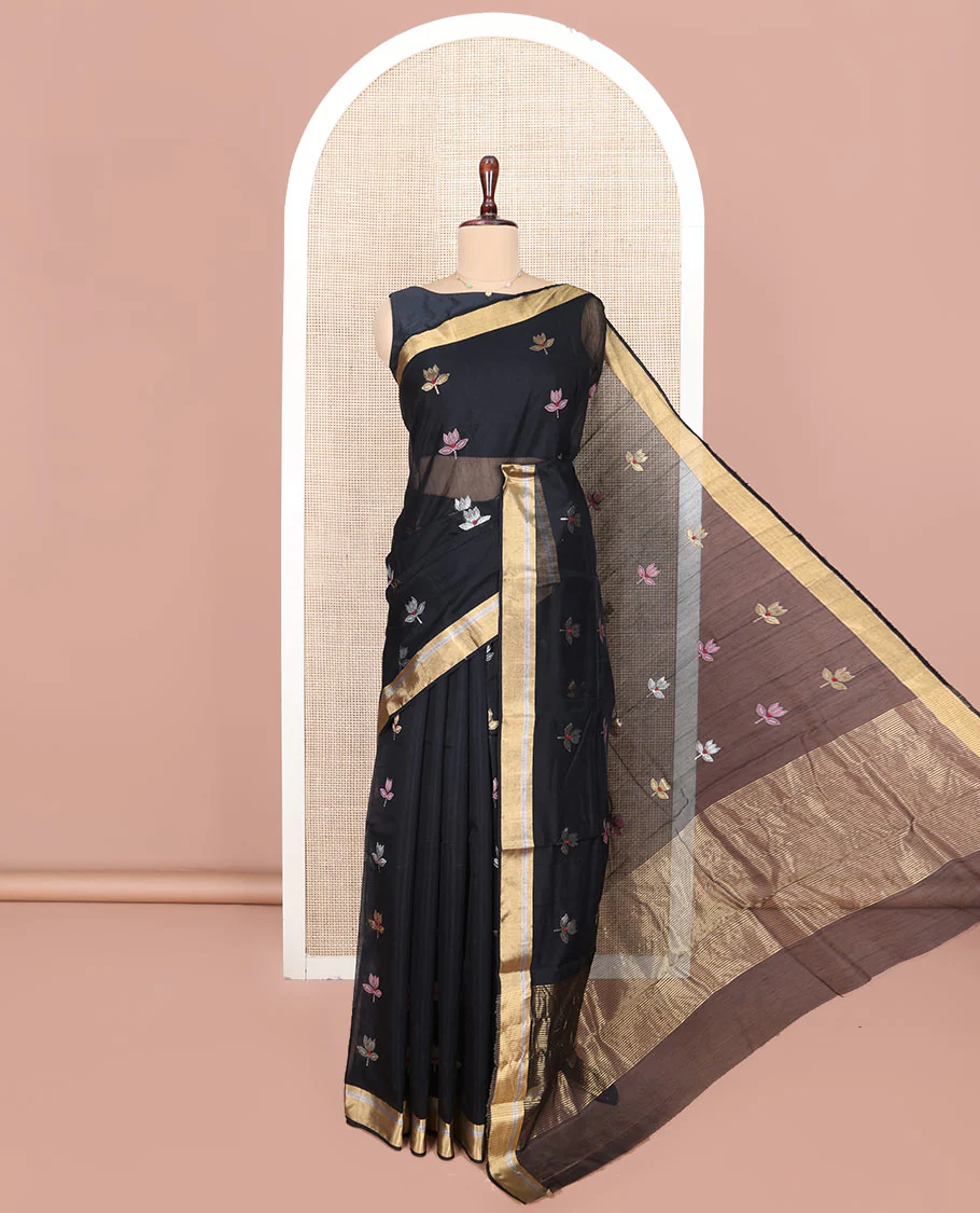 Black Chanderi Cotton Saree, Embellished with Floral Buttas All Over Its Body, Highlighted by Zari Border, Pallu Steeped with Zari Stripes, and Paired with a Matching Blouse