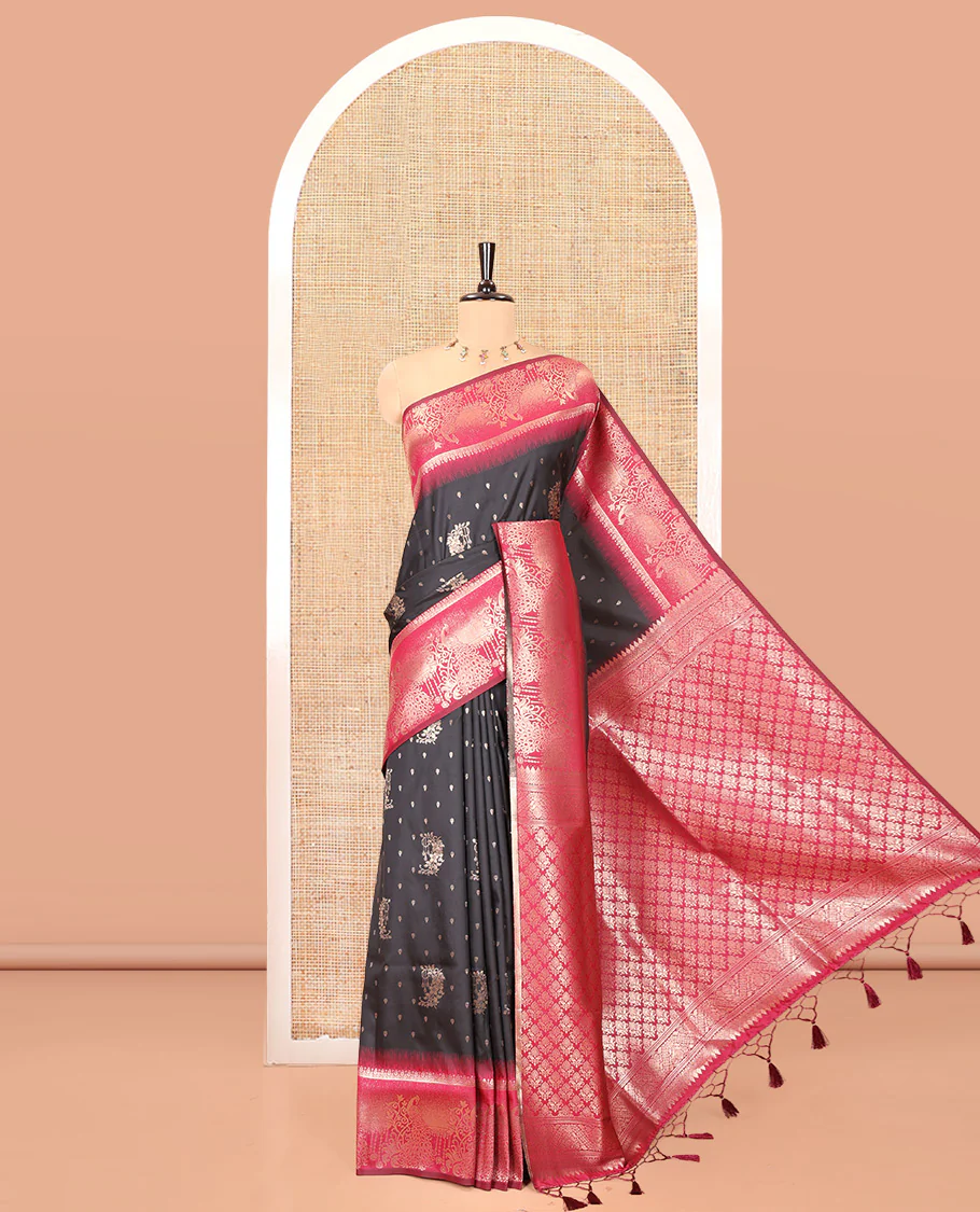 Black Elite Soft Silk Saree, Woven with Zari Buttas on Its Body, Complemented by a Contrast Peacock-Floral Zari Blouse, Intricately Designed Pallu, and Paired with a Contrast Blouse