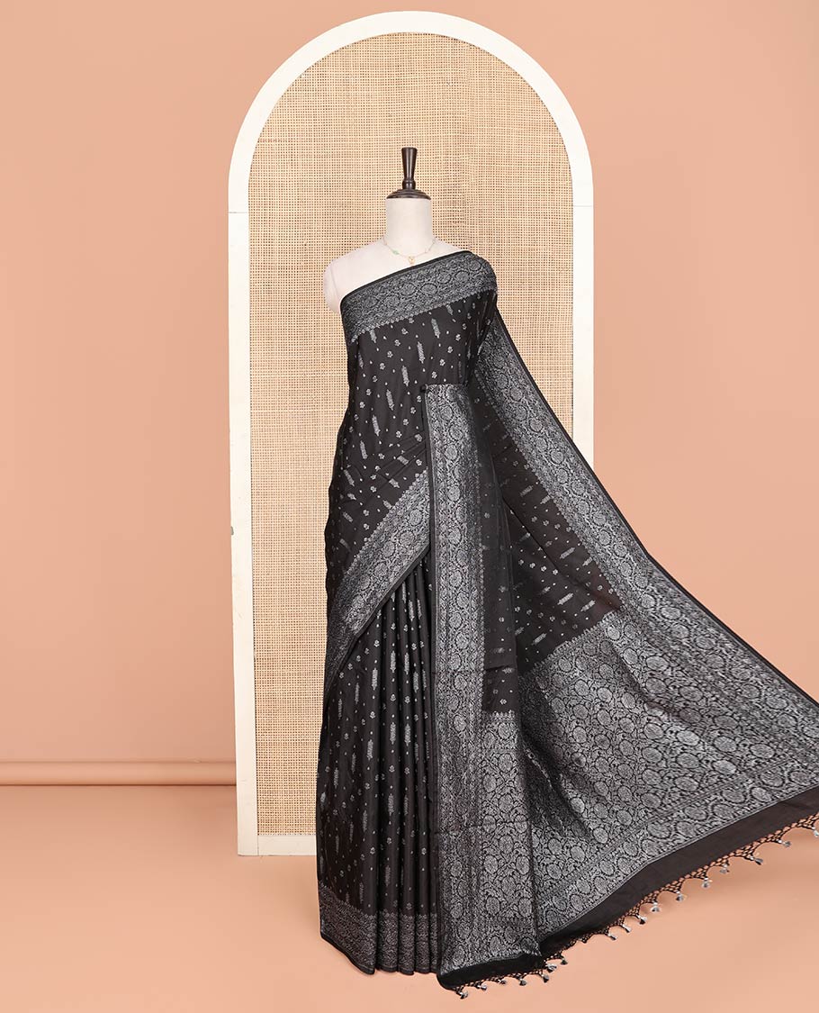 Black Fancy Georgette Saree Decorated with Zari Buttas, Zari Woven Border of Floral Creeper Designs, Zari-Decked Up Pallu of Floral Jaal Designs, and Paired with a Matching Blouse
