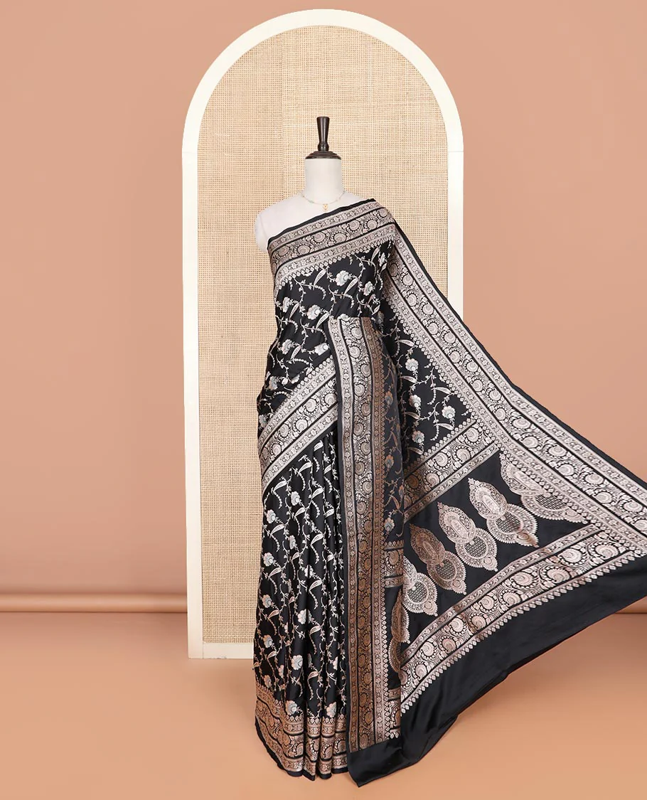 Black floral vine jacquard mushru silk saree, floral-paisley design zari border, and intricate pallu