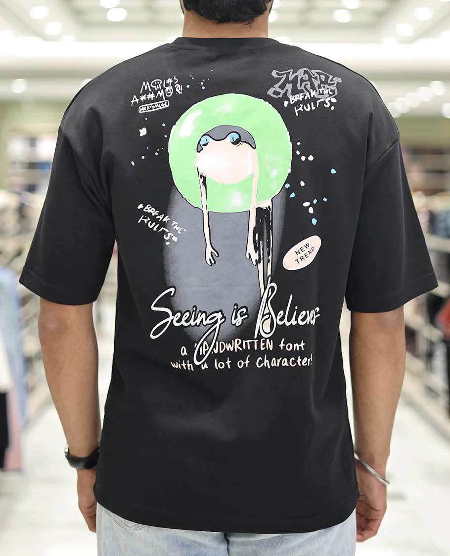 Black Glow in the Dark Cotton-Blended T-Shirt, Bedecked with Colorful Cartoon Motifs Print, Comes with a Crew Neck, Half-Sleeves, Oversized Fit, and Long Length - Image 2