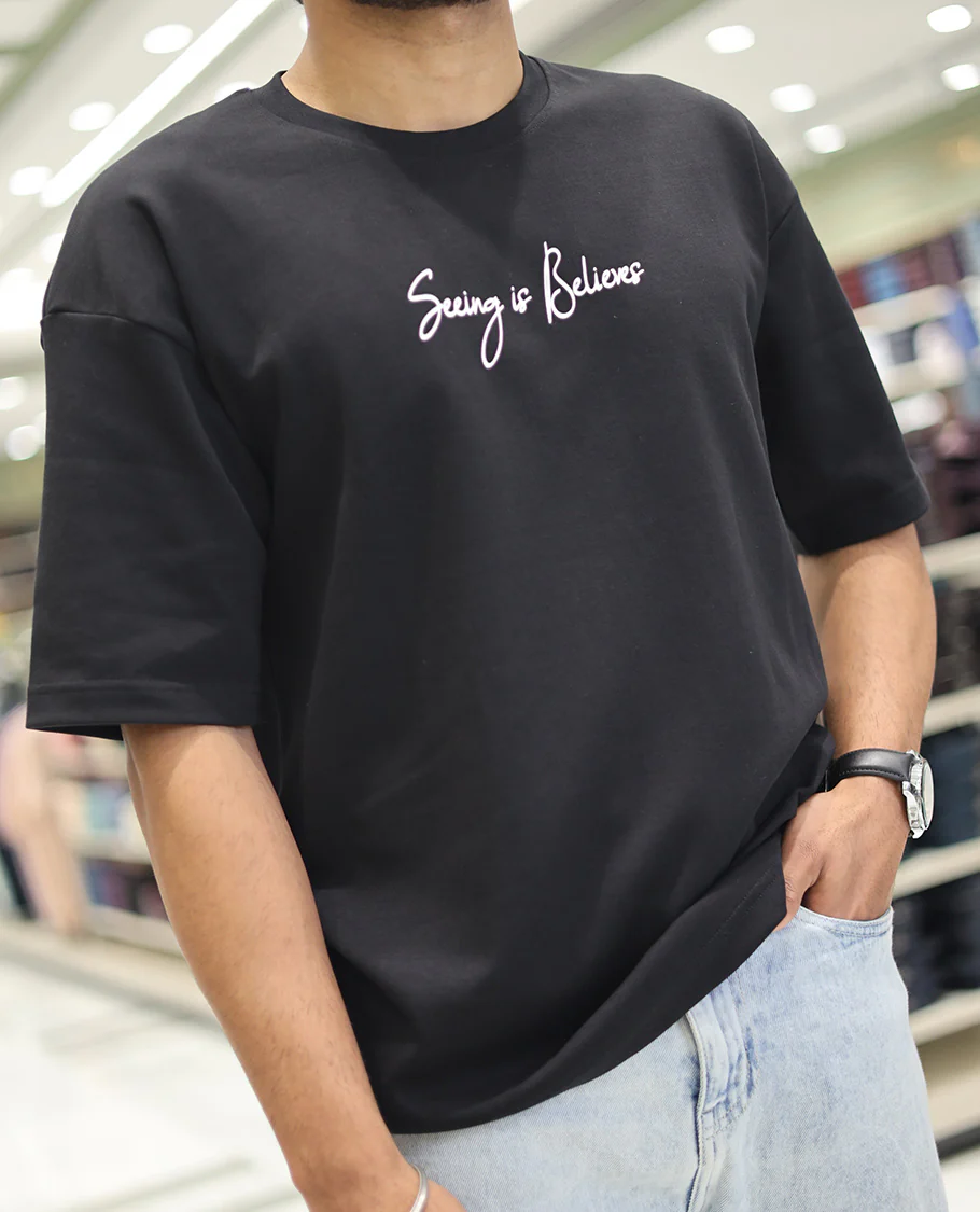 Black Glow in the Dark Cotton-Blended T-Shirt, Bedecked with Colorful Cartoon Motifs Print, Comes with a Crew Neck, Half-Sleeves, Oversized Fit, and Long Length - Image 3