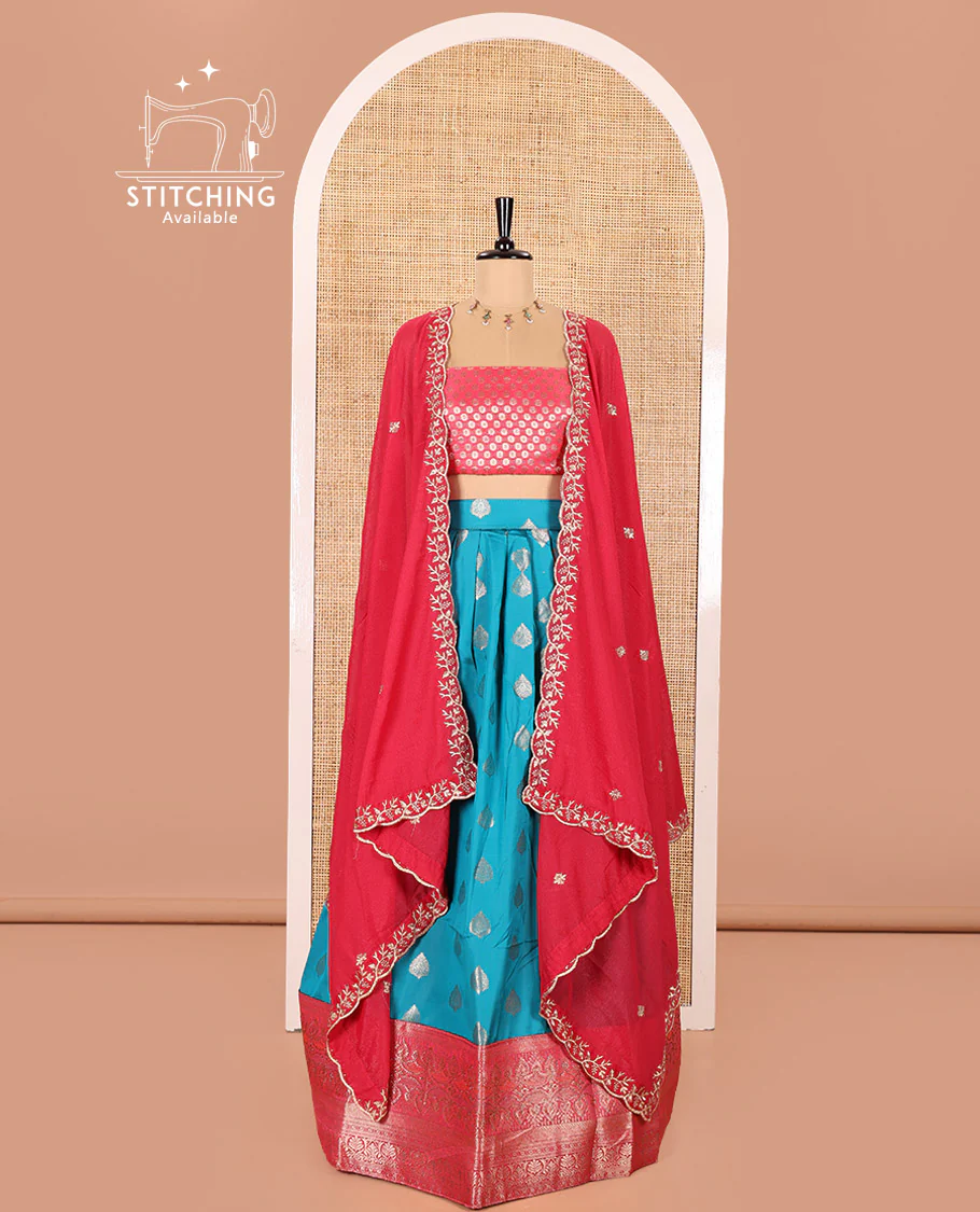 Blue and Rani Pink Semi-Banaras Silk Half-Saree Featuring Zari Buttas All Over the Skirt, Highlighted with a Contrast Traditional Zari Design Border, Rudraksham Motifs Woven Blouse, and a Shimmer Georgette Scallop-Embroidered Dhavani - Image 2