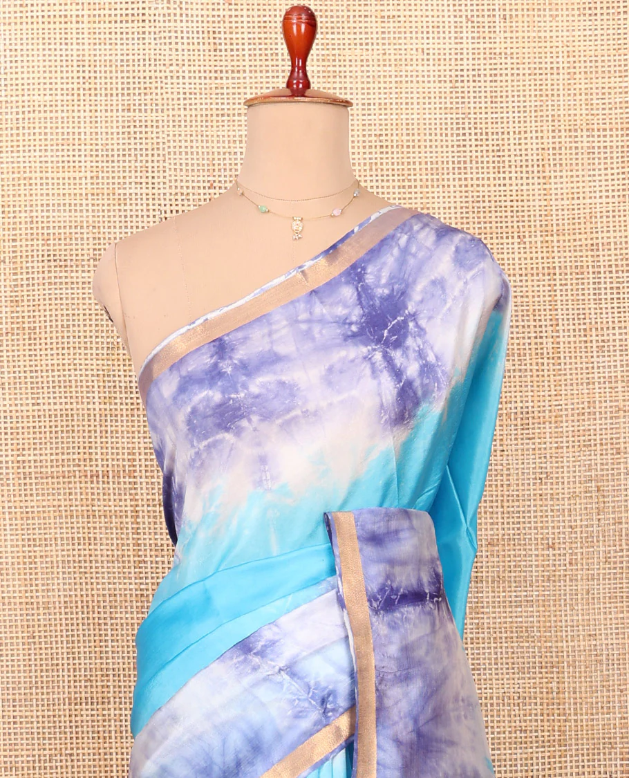 Blue Banana Pith Saree Beautified with Shibori Prints, Subtly Made Zari Bavanji Border, Pallu Featuring Zari Stripes and Shibori Print, and Paired with a Matching Shibori Printed Blouse - Image 2