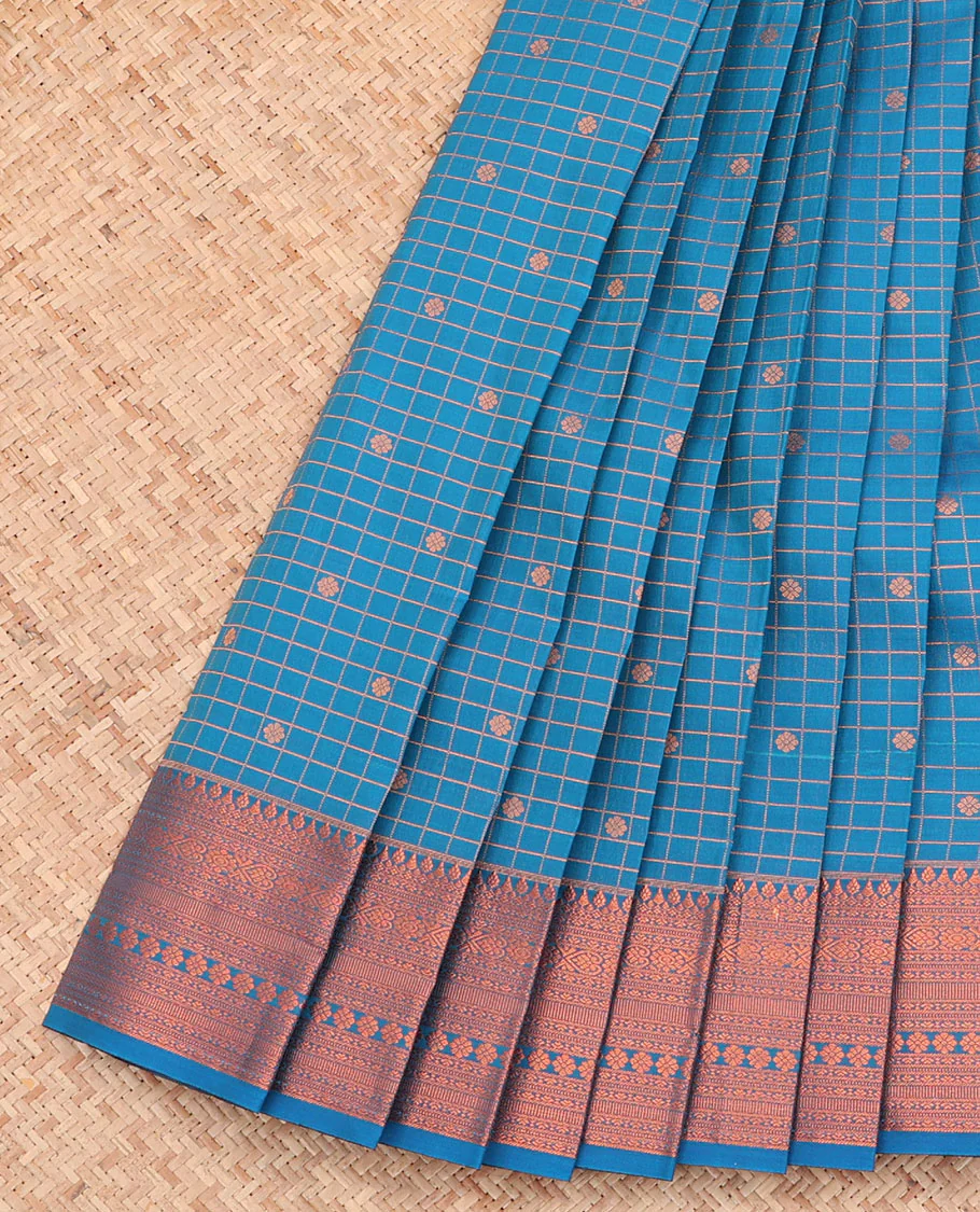 Blue Budget Silk Saree, Detailed with Zari Buttas and Checks All Over Its Body, Highlighted by a Traditional Zari Design Border, Grand Pallu, and Paired with a Matching Blouse