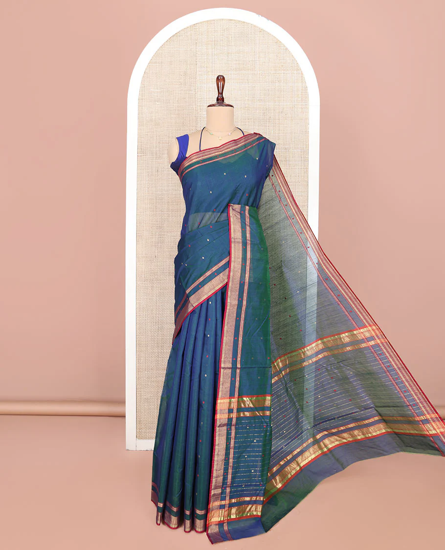 Blue Chanderi Cotton Saree, Showcasing Buttas All Over Its Body, Complemented by a Contrast Border, Pallu Steeped with Zari Stripes, and Paired with a Matching Blouse