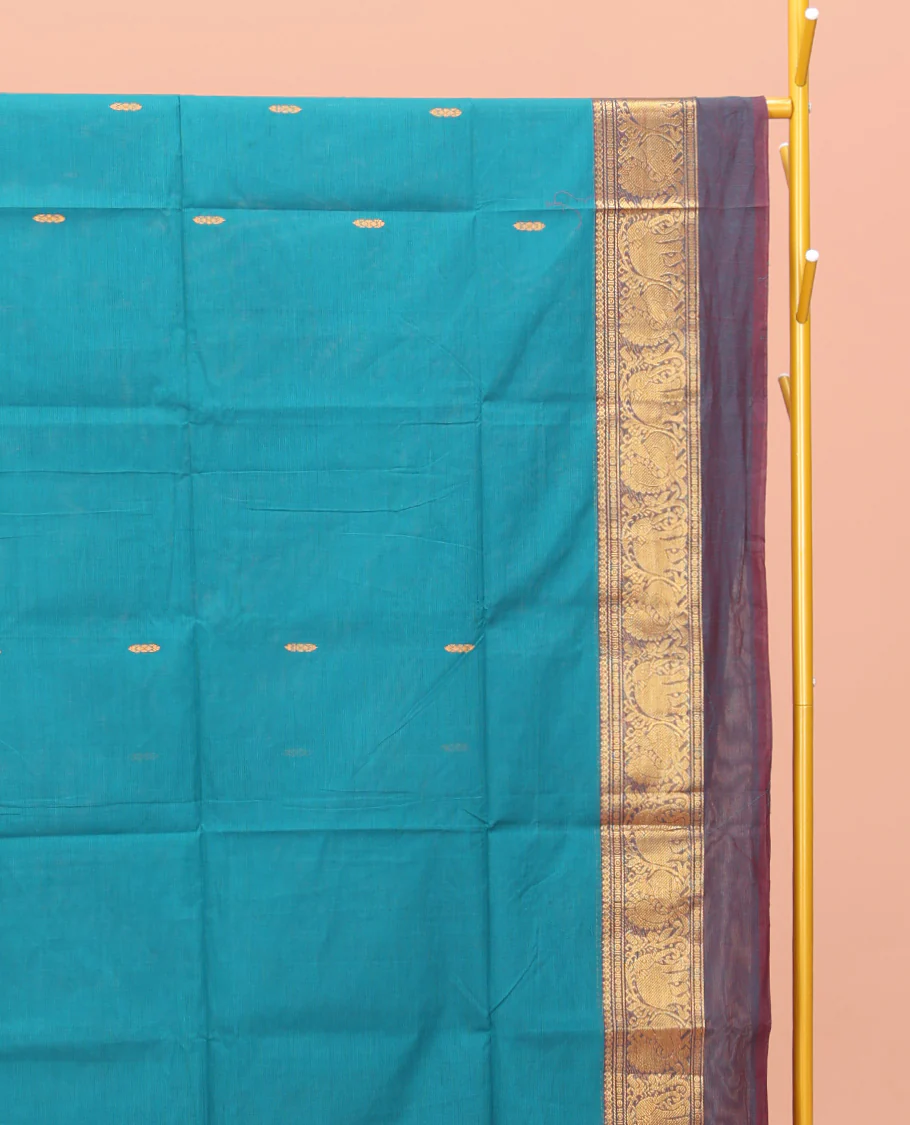 Blue Chettinad Cotton Saree, Adorned with Buttas All Over Its Body, Complemented by a Contrast Ganga-Jamuna Kal Eragina Border of Kodi Peacock and Elephant Designs, Pallu of Buttas and Stripes, and Paired with a Matching Blouse - Image 2