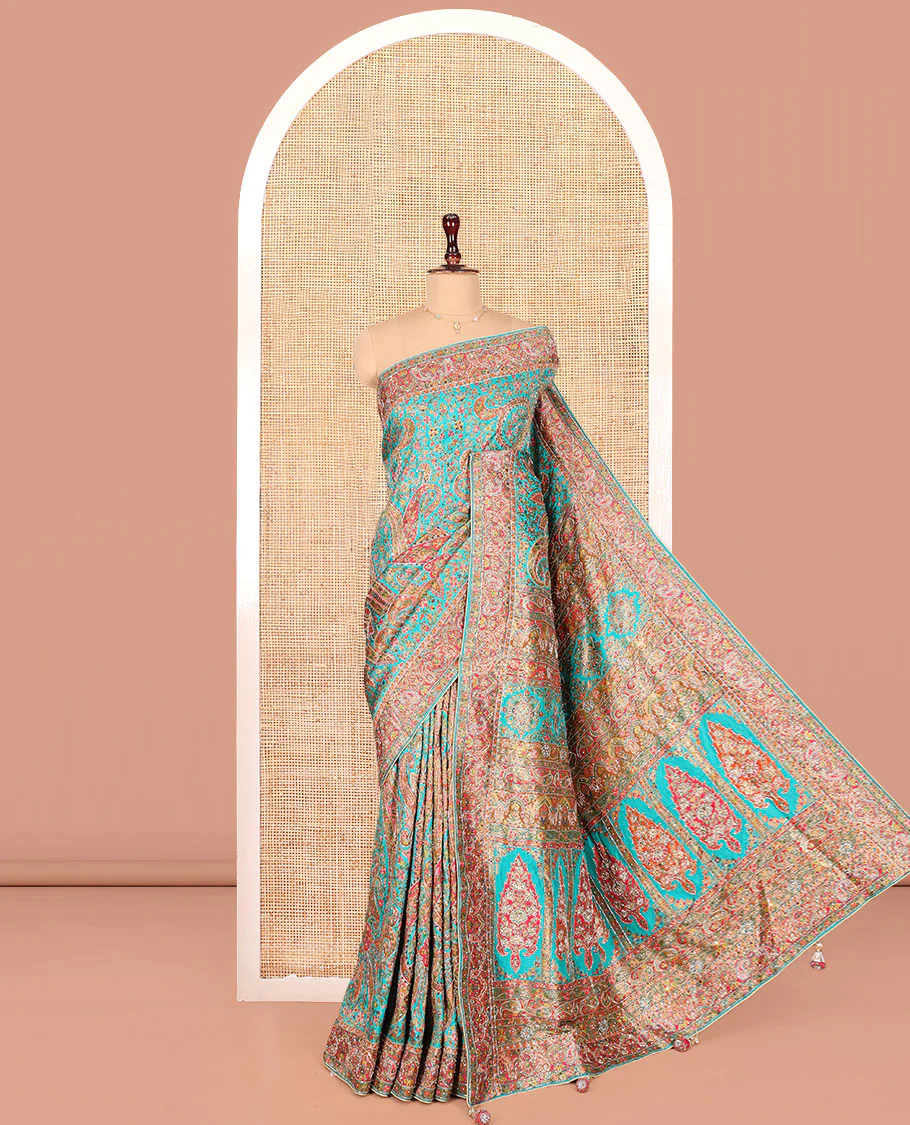 Blue Dola Silk Saree, Beautifully Bedecked with Colorful Floral-Paisley Design on Its Body, Complemented by Contrast Paisley Border, Pallu of Mughal-Style Design, and Paired with a Matching Blouse