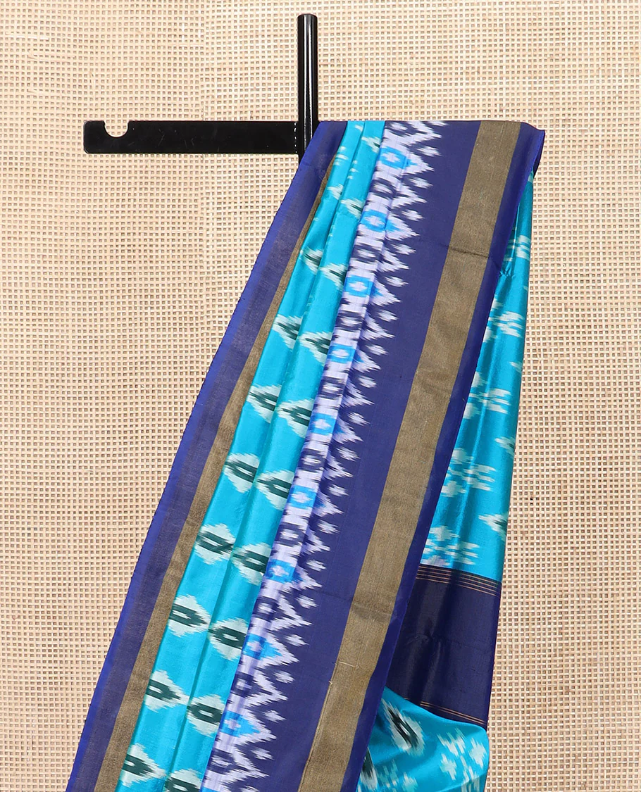 Blue Ikkat Silk Saree Decorated with Ikkat Buttas, Complemented by a Contrast Border, a Subtly Woven Pallu of Jaal Design, and a Contrast Plain Blouse - Image 3