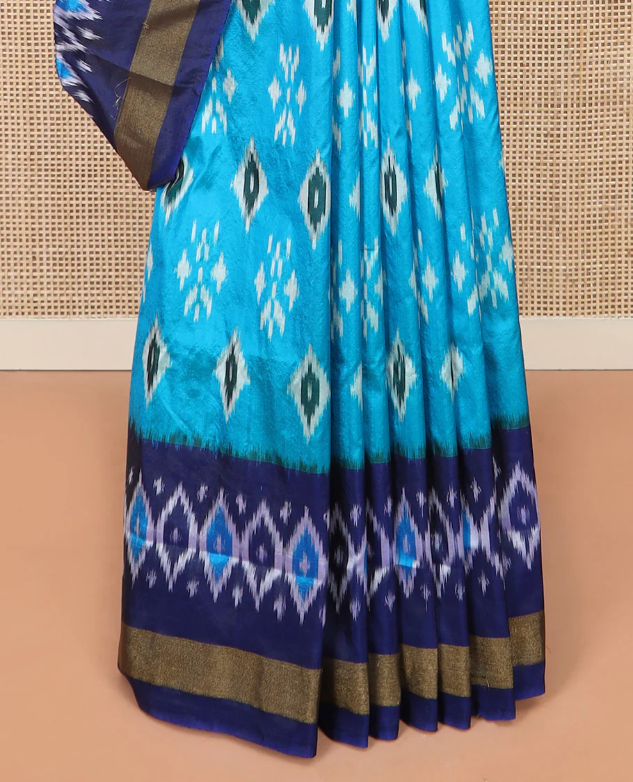 Blue Ikkat Silk Saree Decorated with Ikkat Buttas, Complemented by a Contrast Border, a Subtly Woven Pallu of Jaal Design, and a Contrast Plain Blouse - Image 4