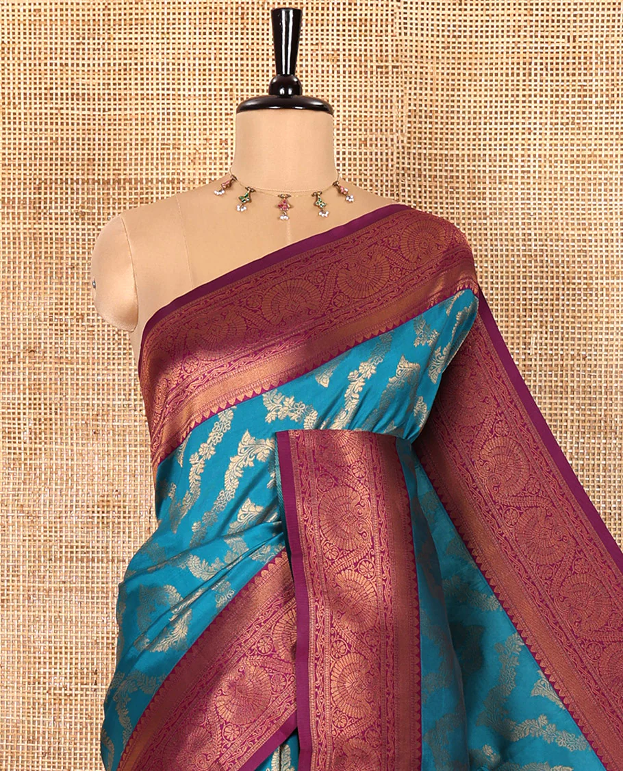 Blue Kanchi Silk Saree Mesmerized with Floral Jacquard Design All Over Its Body, Complemented by a Contrast Traditional Zari Border of Floral Creeper Designs, an Opulently Embellished Pallu, and Paired with a Contrast Jacquard Blouse - Image 2