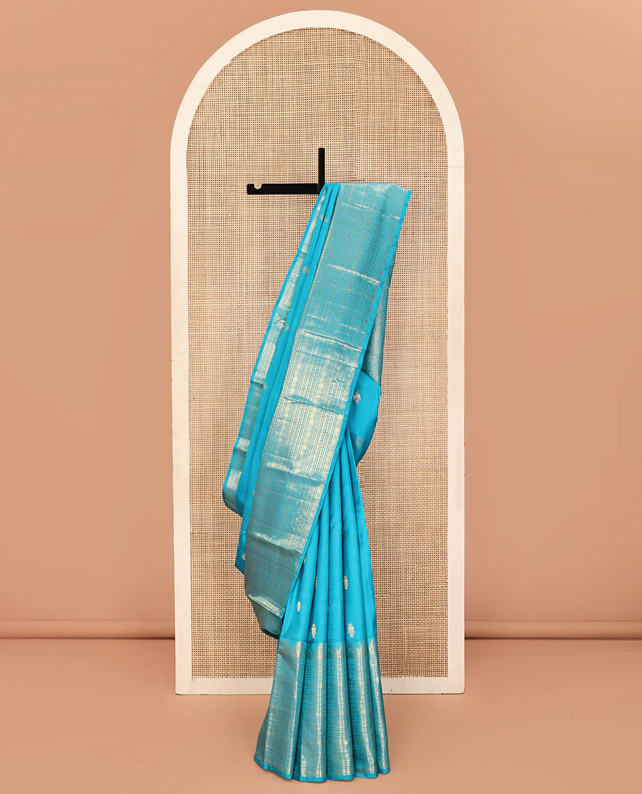 Blue Kanchipuram Silk Saree, Decorated with Iruthalai Pakshi Buttas All Over Its Body, Highlighted by a Zari Border of Puli Nagam, Manga, Kamalam, and Kodi Visiry Designs, Pallu of Human Figurines, and Paired with a Matching Blouse