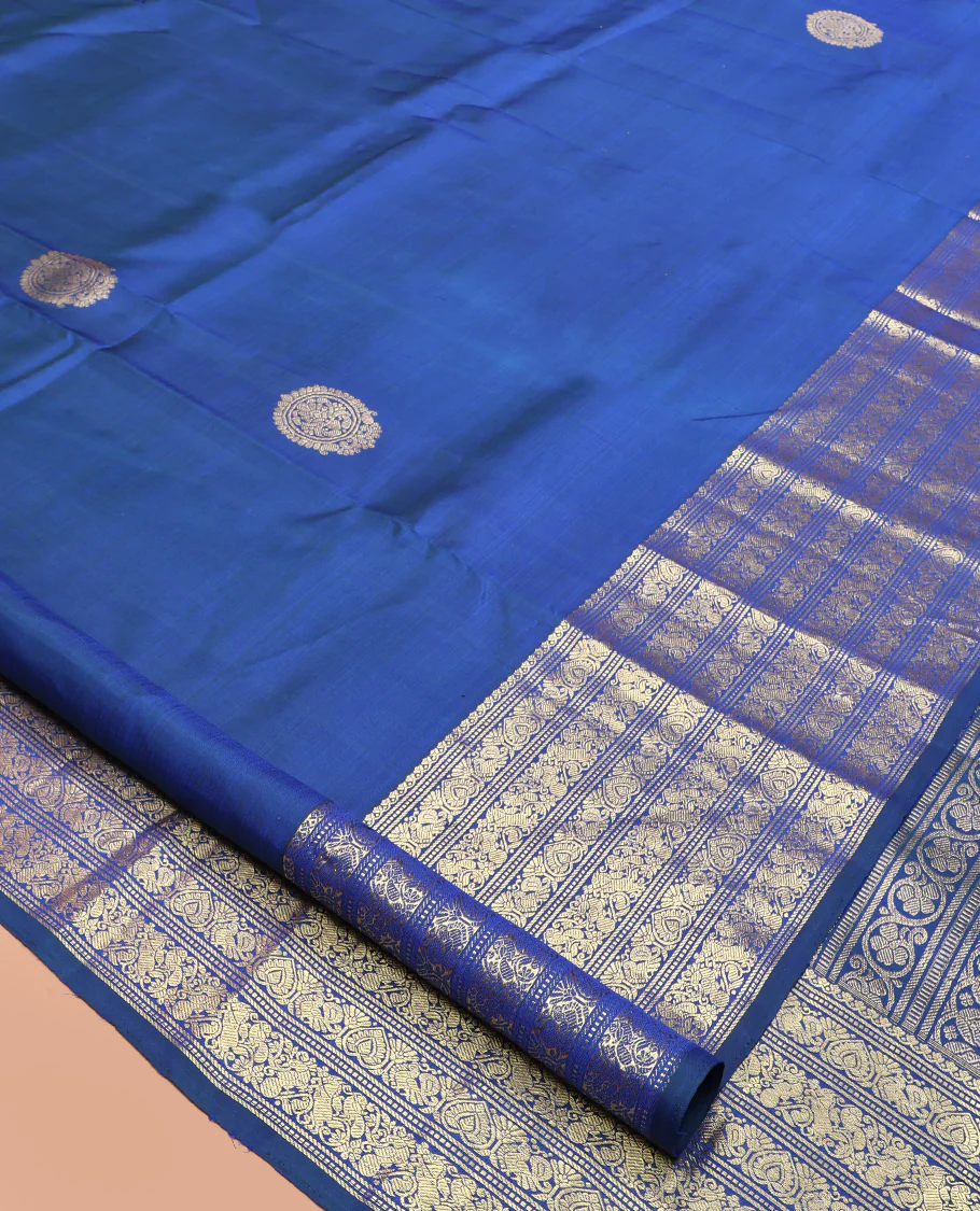 Blue Kanchipuram Silk Saree, Decorated with Zari Buttas All Over Its Body, Highlighted by a Zari Border of Salngai, Muthu, Mayil, and Kuthirai Designs, Grand Jaal Pallu, and Paired with a Matching Blouse - Image 2
