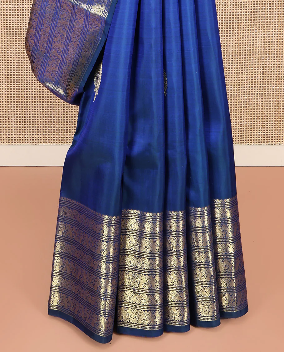 Blue Kanchipuram Silk Saree, Decorated with Zari Buttas All Over Its Body, Highlighted by a Zari Border of Salngai, Muthu, Mayil, and Kuthirai Designs, Grand Jaal Pallu, and Paired with a Matching Blouse - Image 4