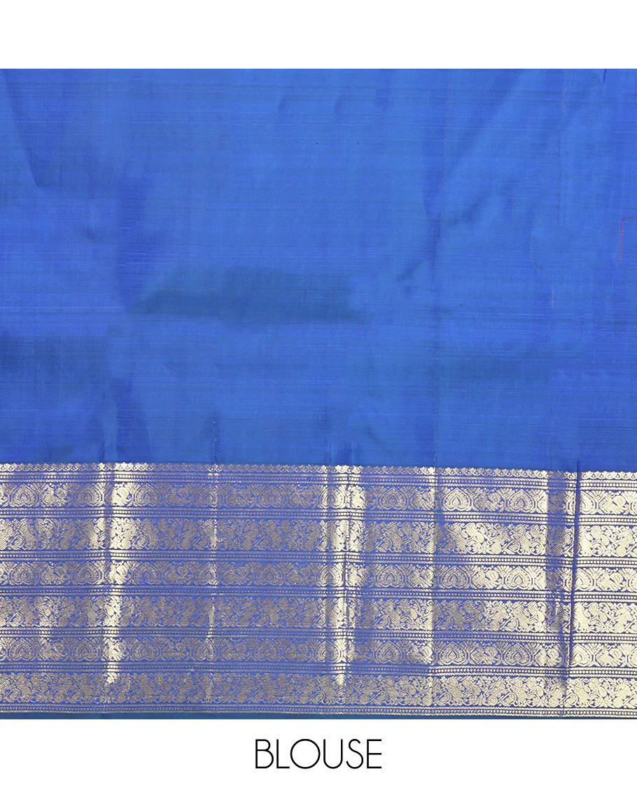 Blue Kanchipuram Silk Saree, Decorated with Zari Buttas All Over Its Body, Highlighted by a Zari Border of Salngai, Muthu, Mayil, and Kuthirai Designs, Grand Jaal Pallu, and Paired with a Matching Blouse - Image 6
