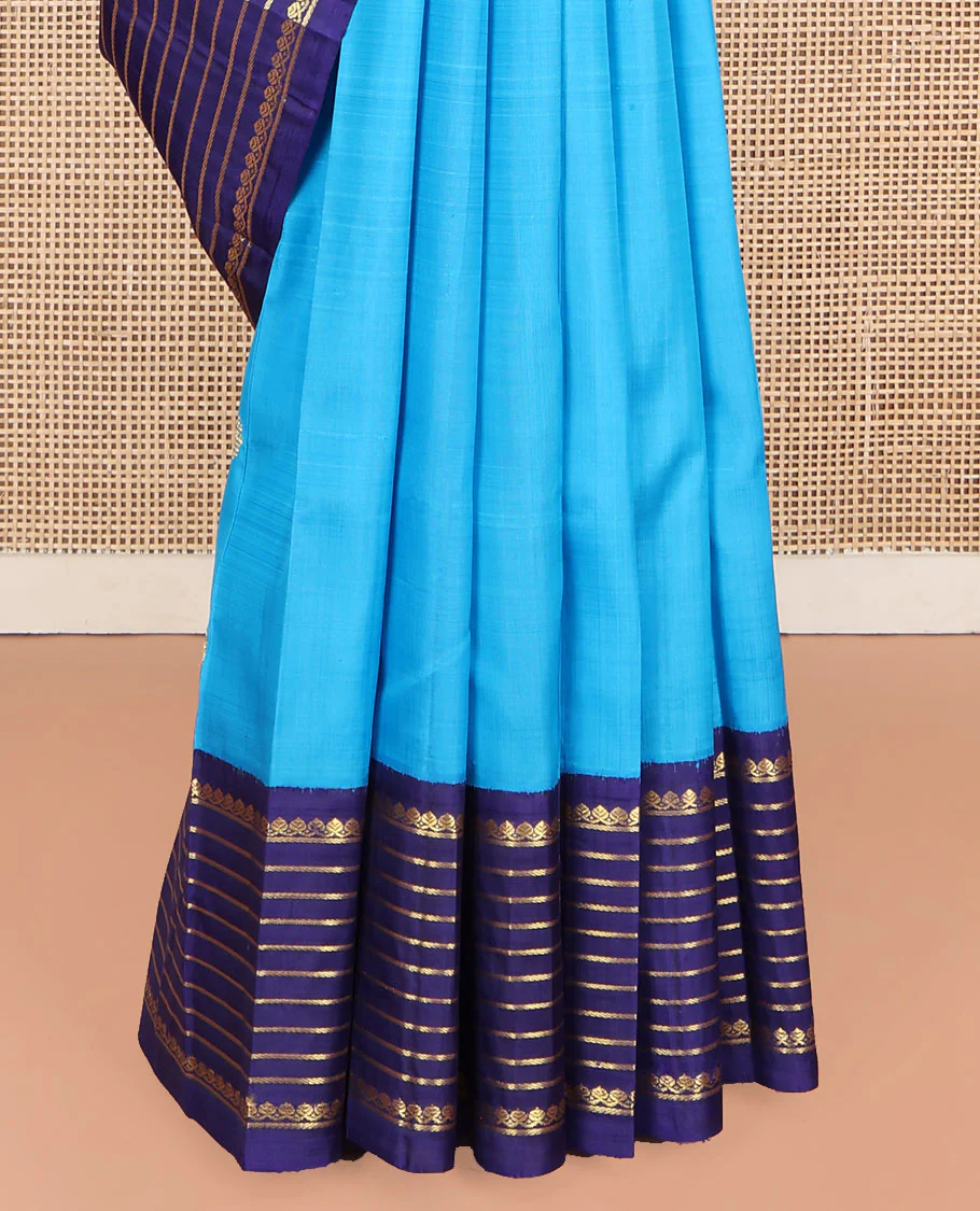 Blue Kanchipuram Silk Saree, Embellished with Zari Buttas, Complemented by Contrast One-Sided Korvai Border of Thilakam Mokku and Banaras Designs, Pallu Steeped with Floral Designs, and Comes Without a Blouse - Image 4