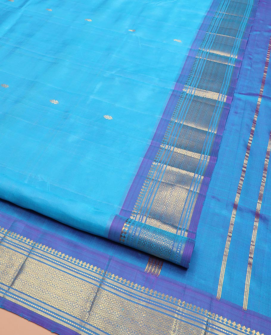 Blue Kanchipuram Silk Saree Enthralled with Zari Buttas All Over Its Body, Complemented by a Contrast One-Sided Border of Paneer Sombu, Banaras, Muthu, and Jaal Designs, Zari Design Pallu, and Comes Without a Blouse - Image 3