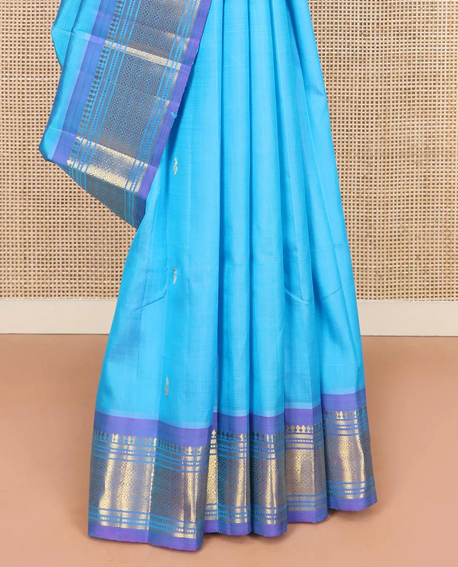 Blue Kanchipuram Silk Saree Enthralled with Zari Buttas All Over Its Body, Complemented by a Contrast One-Sided Border of Paneer Sombu, Banaras, Muthu, and Jaal Designs, Zari Design Pallu, and Comes Without a Blouse - Image 4