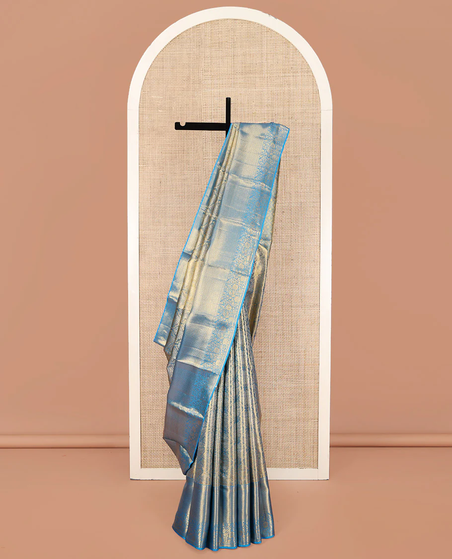 Blue Kanchipuram Silk Saree, Mesmerized with Zari Jacquard Design All Over Its Body, Highlighted by a Zari Border of Thilakam, Muthu, Kathir, Diamond, and Floral Designs, and Pallu of Jaal Designs, and Paired with a Matching Blouse