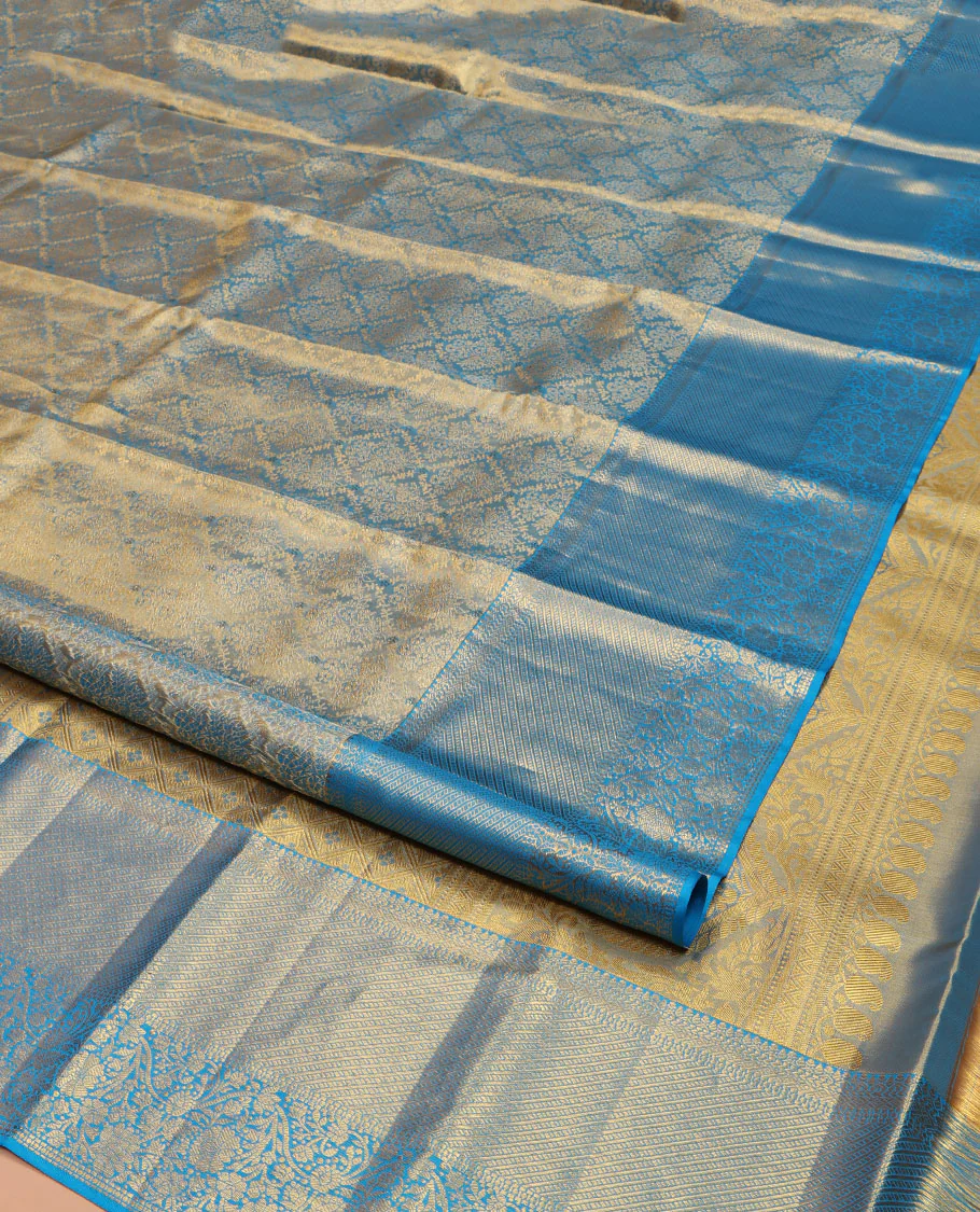 Blue Kanchipuram Silk Saree, Mesmerized with Zari Jacquard Design All Over Its Body, Highlighted by a Zari Border of Thilakam, Muthu, Kathir, Diamond, and Floral Designs, and Pallu of Jaal Designs, and Paired with a Matching Blouse - Image 2