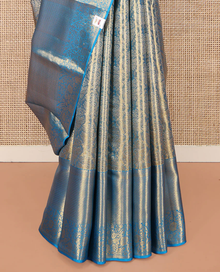 Blue Kanchipuram Silk Saree, Mesmerized with Zari Jacquard Design All Over Its Body, Highlighted by a Zari Border of Thilakam, Muthu, Kathir, Diamond, and Floral Designs, and Pallu of Jaal Designs, and Paired with a Matching Blouse - Image 4