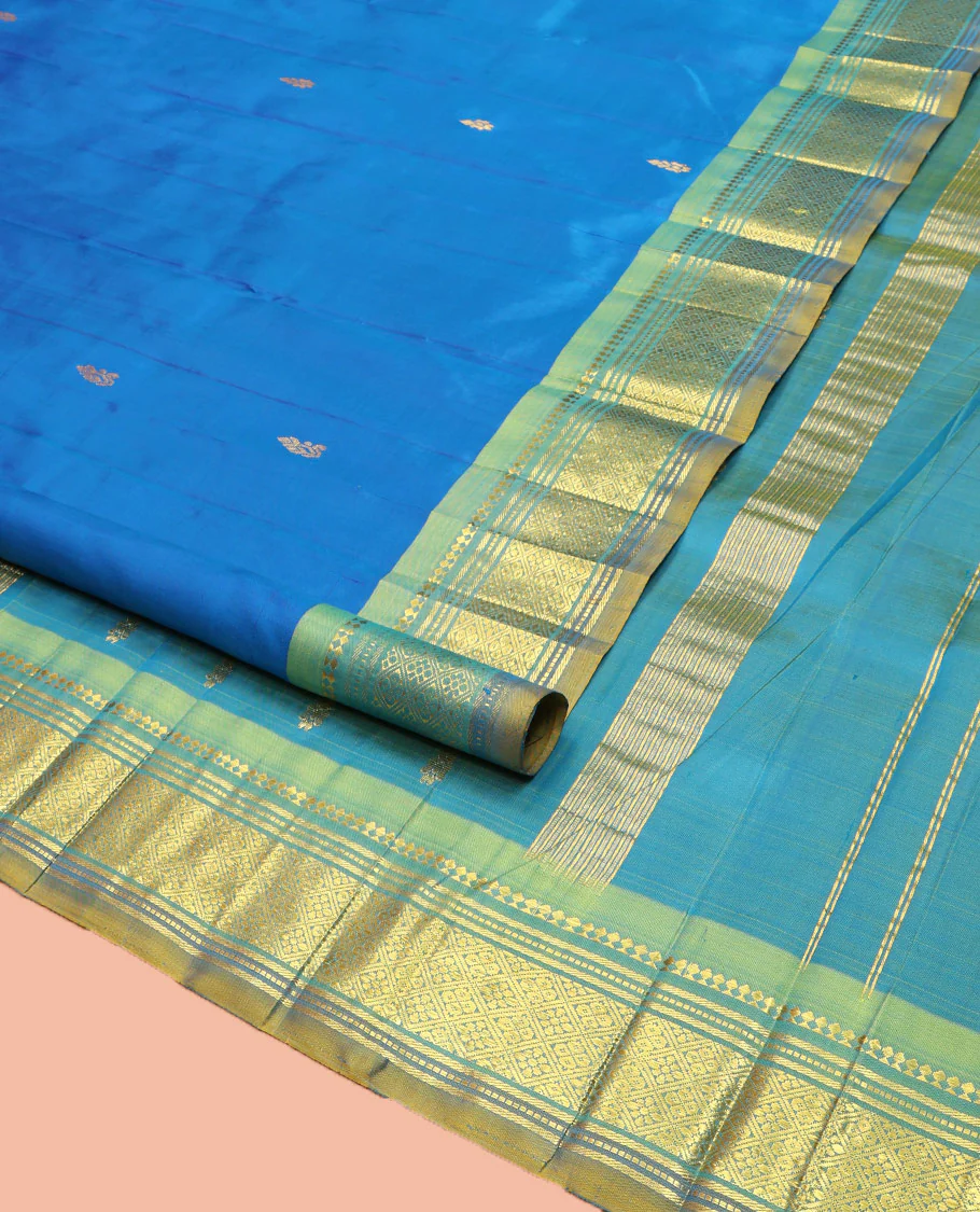 Blue Kanchipuram Silk Saree, Spotlighted with Zari Buttas on Its Body, Complemented by Contrast One-Sided Border of Panner Sombu, Banaras, Muthu, and Jaal Designs, Pallu Features Zari Designs, and Comes Without a Blouse - Image 2