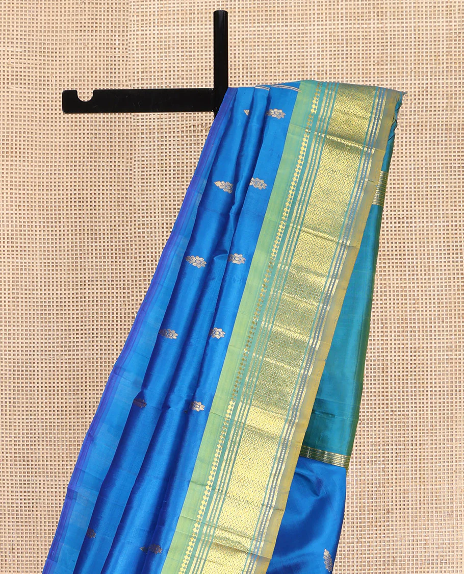Blue Kanchipuram Silk Saree, Spotlighted with Zari Buttas on Its Body, Complemented by Contrast One-Sided Border of Panner Sombu, Banaras, Muthu, and Jaal Designs, Pallu Features Zari Designs, and Comes Without a Blouse - Image 3