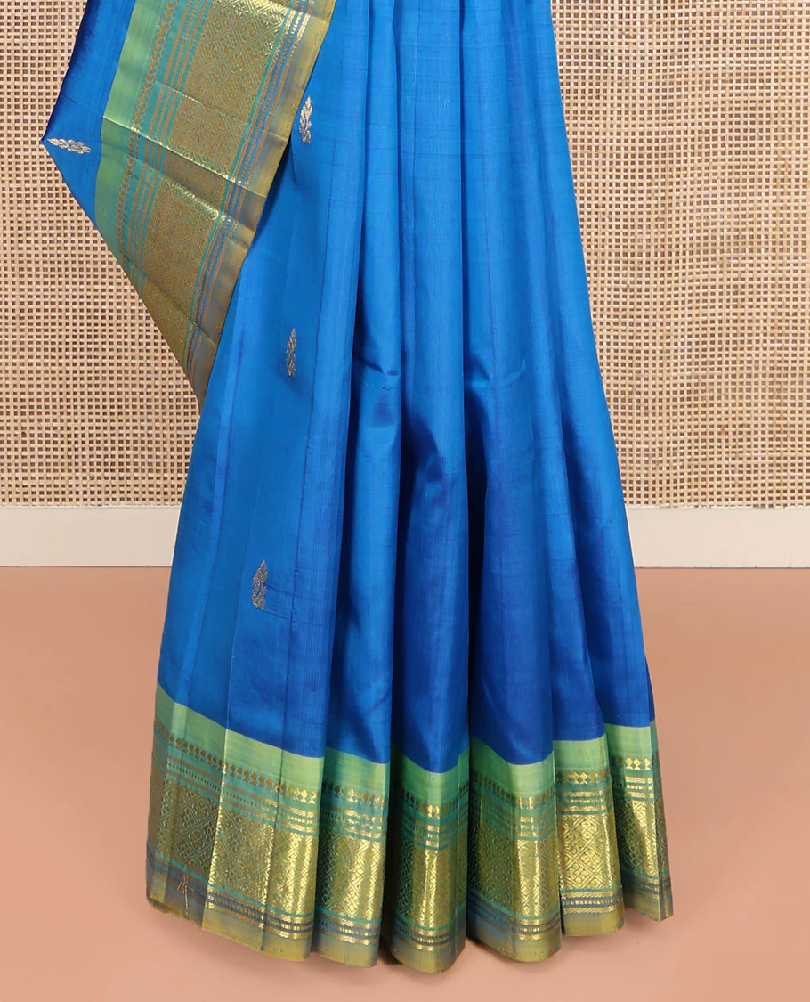 Blue Kanchipuram Silk Saree, Spotlighted with Zari Buttas on Its Body, Complemented by Contrast One-Sided Border of Panner Sombu, Banaras, Muthu, and Jaal Designs, Pallu Features Zari Designs, and Comes Without a Blouse - Image 4