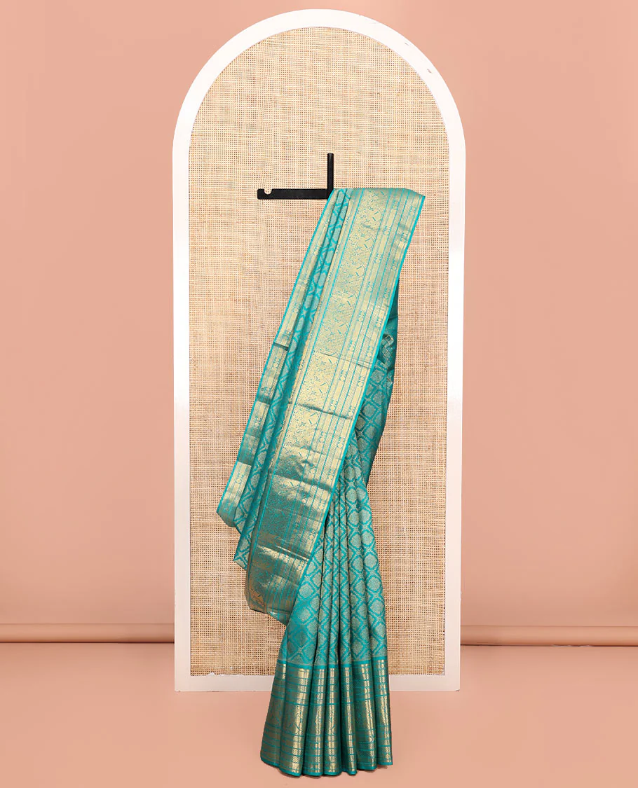 Blue Kanchipuram Wedding Silk Saree, Finely Crafted with Jacquard Design on Its Body, Highlighted by Zari Border of Mayil Kann, Rudraksham, Kamalam, and Iruthalai Pakshi Designs, Intricately Designed Pallu, and Paired with a Matching Blouse