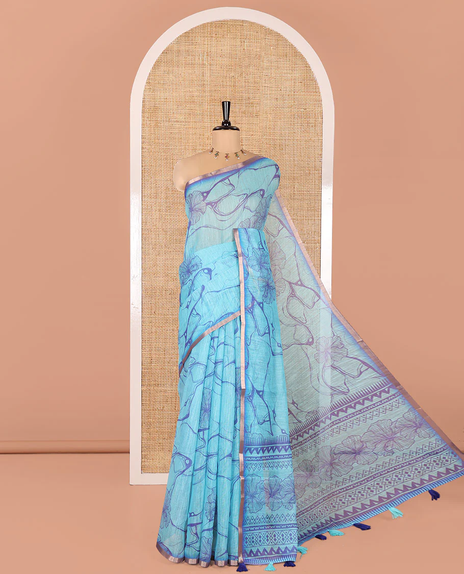 Blue Linen Cotton Saree, Adorned with Abstract Floral Print On Its Body, Subtle Piping Border, Pallu of Floral and Geometric Print, and Paired with a Contrast Blouse