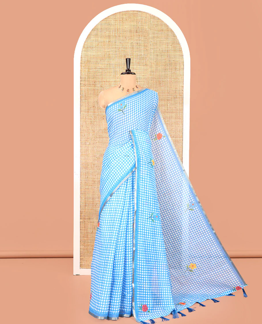 Blue Linen Cotton Saree, Decorated with Micro-Checks and Floral Motifs on Its Body, Subtle Piping Border, a Self-Pallu, and Paired with a Rose Floral Printed Blouse
