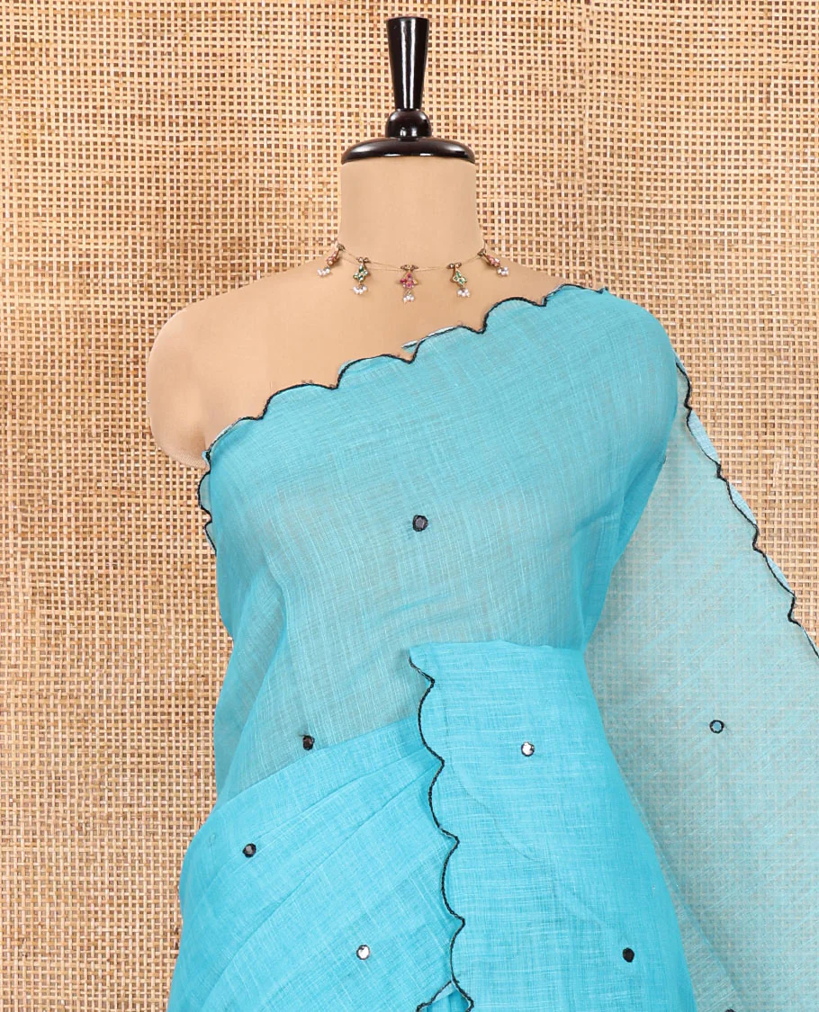 Blue Linen Cotton Saree, Embellished with Mirror Work All Over Its Body, Subtly Scallop Border, Complemented by Contrast Pallu of Stripes and Mirror Work, and Paired with a Contrast Geometric Printed Blouse - Image 2