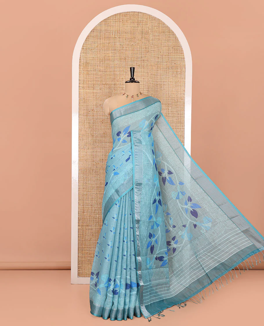 Blue Linen Cotton Saree, Prettified with Leaf Vine Printed on Its Body, Contrast Bavanji Border, Printed Pallu, and Paired with a Contrast Blouse