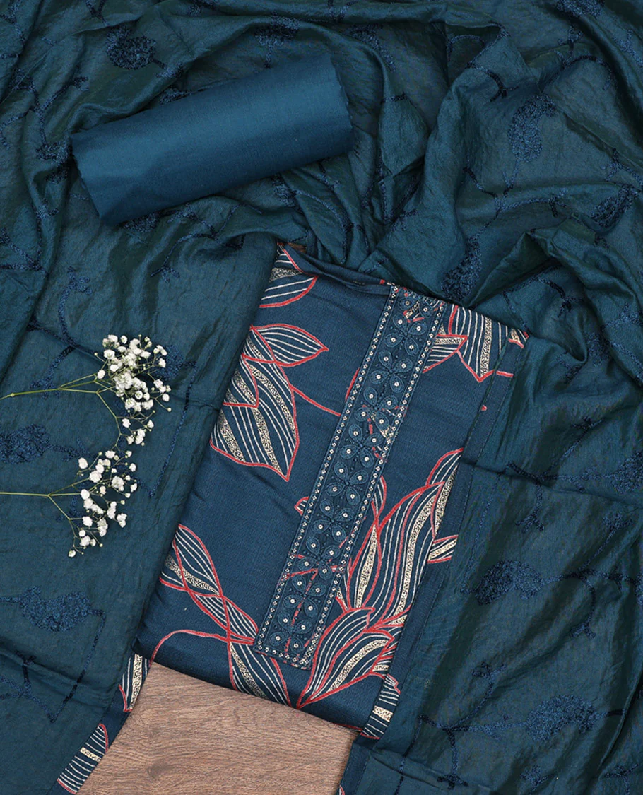 Blue Material Chudidar Set, Embellished with Leaf-Floral Print and Neck Embroidery on Rayon Top, a Plain Rayon Bottom, and Paired with a Matching Embroidered Chanderi Silk Dupatta