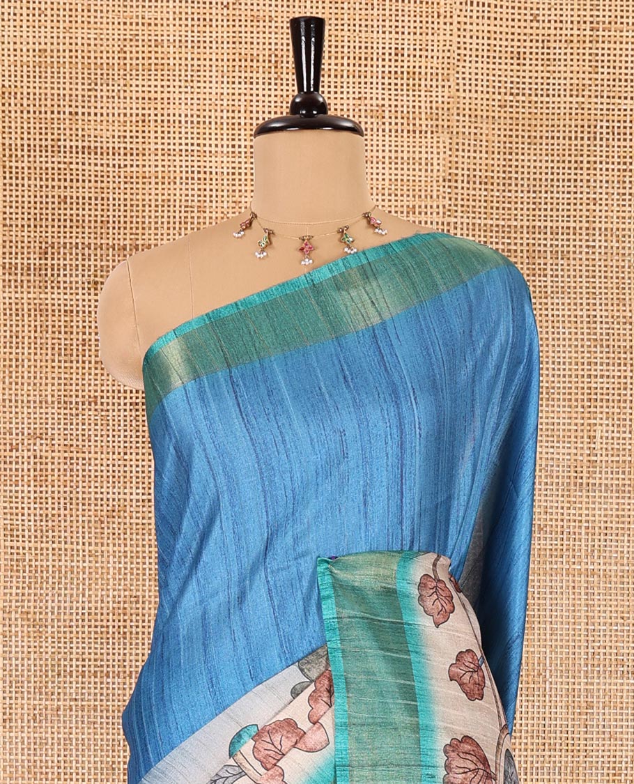 Blue plain fancy tussar saree, contrast floral printed border, floral vine printed pallu, and a contrast plain blouse - Image 3