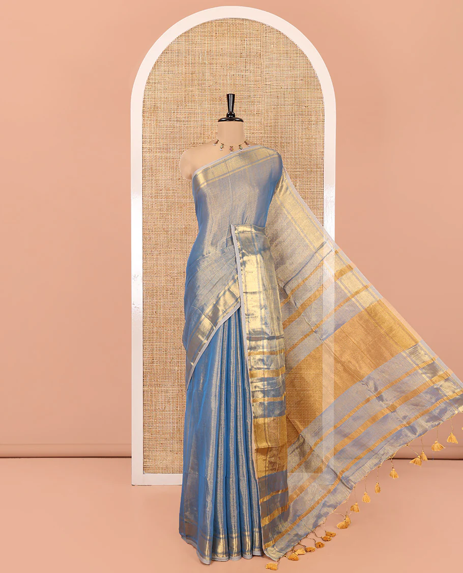 Blue Plain Khadi Tissue Saree, a Gleaming Zari Bavanji Border, Golden Zari Striped Pallu, and Paired with a Matching Blouse