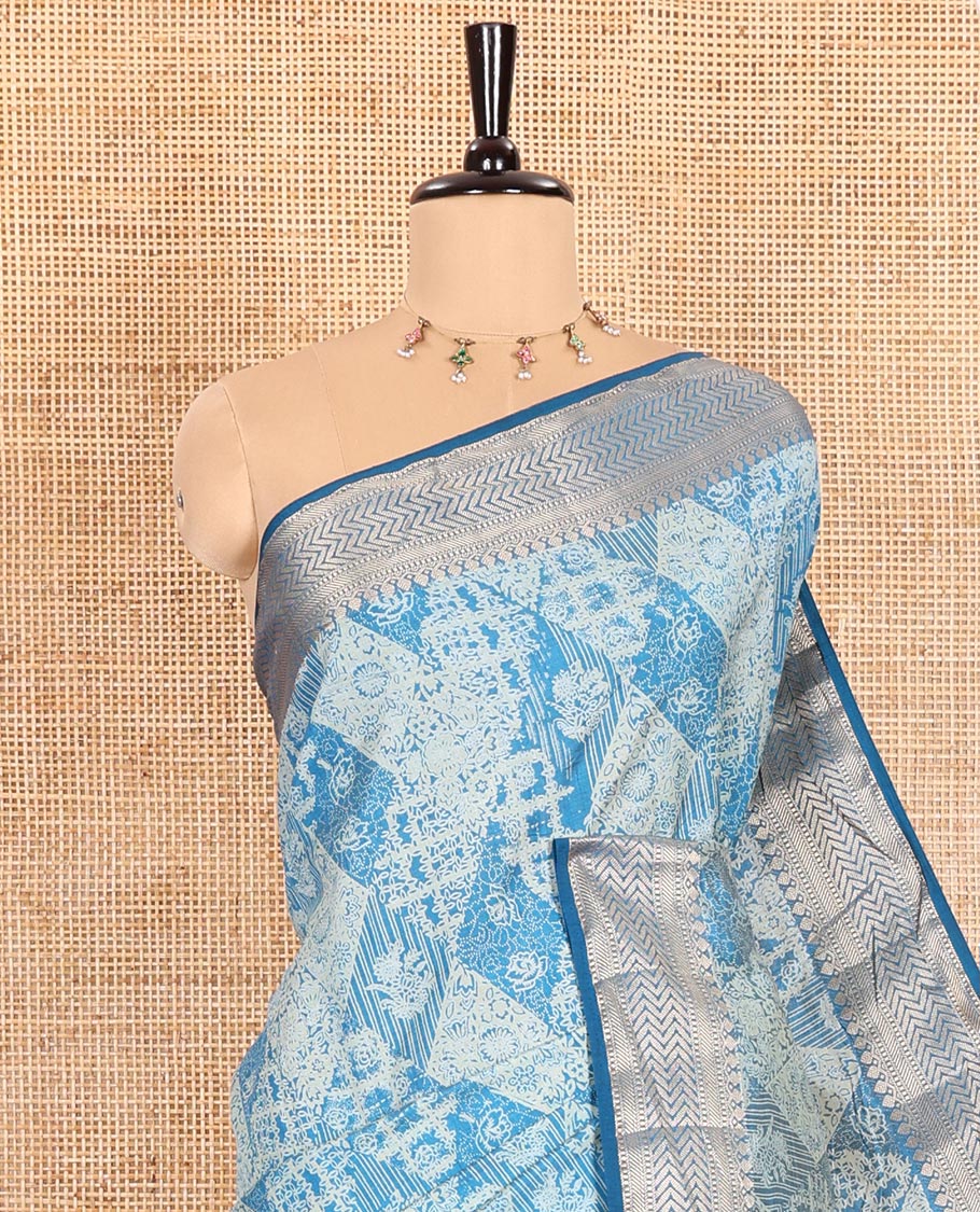 Blue Semi-Tussar Saree Meticulously Crafted with Floral-Enclosed Diamond Patterns Printed Across the Body, Featuring a Subtly Woven Border with Traditional Zari Designs, and a Pallu Elevated with Zari Stripes, Paired with a Matching Blouse - Image 2