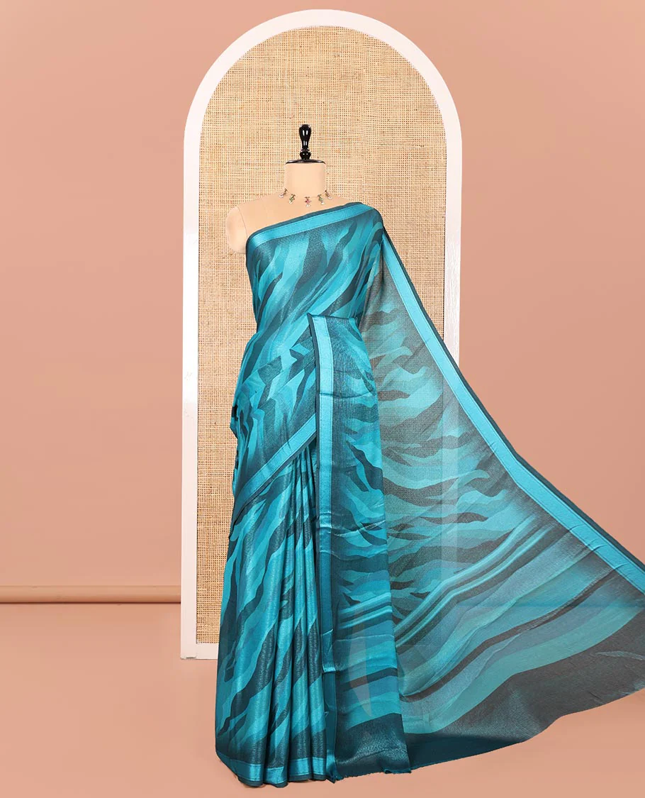 Blue Shimmer Chiffon Saree, Uniquely Printed with Abstract-Style Animal-Skin Texture Print All Over Its Body, Subtle Satin Piping Border, Pallu Mirrors the Same Print, and Paired with a Matching Blouse