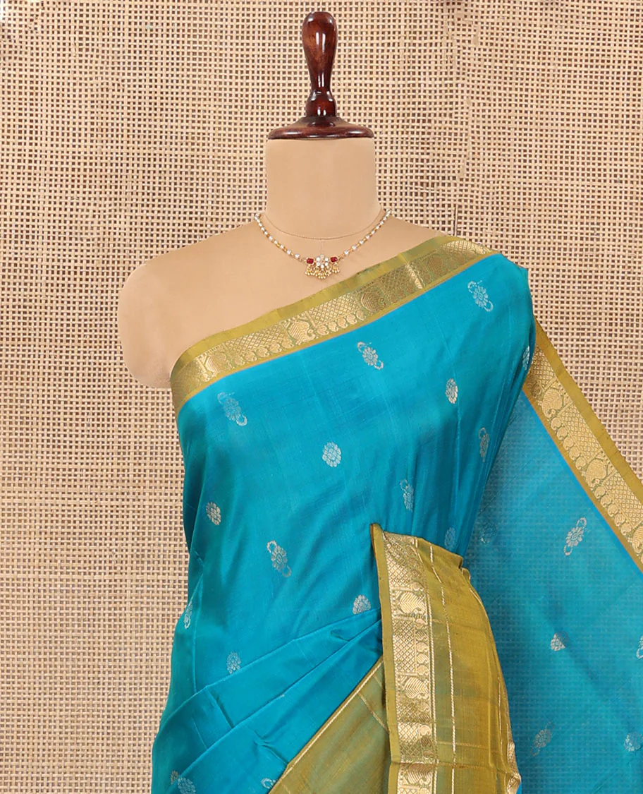 Blue Uppada Silk Saree Graced with Zari Buttas, Complemented by a Contrast Traditional Zari Border of Peacock Veena Designs, Contrast Pallu of Floral Jaal Designs, and Paired with a Contrast Blouse - Image 2