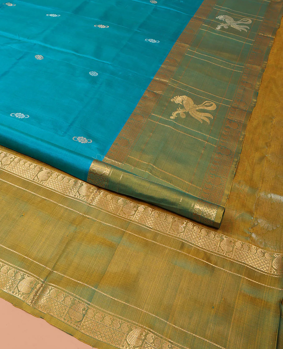 Blue Uppada Silk Saree Graced with Zari Buttas, Complemented by a Contrast Traditional Zari Border of Peacock Veena Designs, Contrast Pallu of Floral Jaal Designs, and Paired with a Contrast Blouse - Image 3