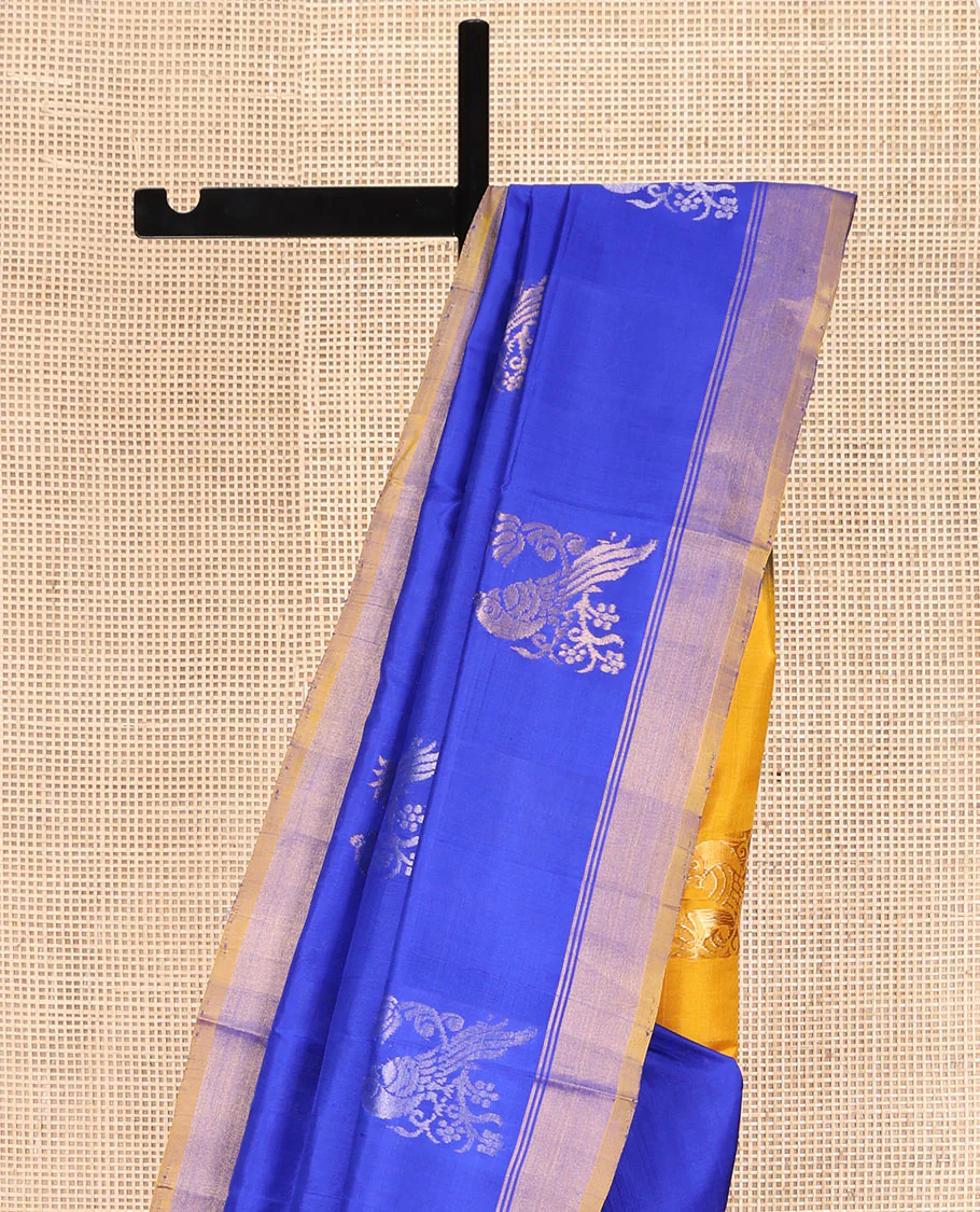 Blue Uppada Silk Saree, Showcasing Parrot Zari Buttas on Its Body, Subtle Zari Border, Complemented by a Contrast Pallu Depicting Parrot Zari Buttas, and Paired with a Contrast Blouse - Image 3