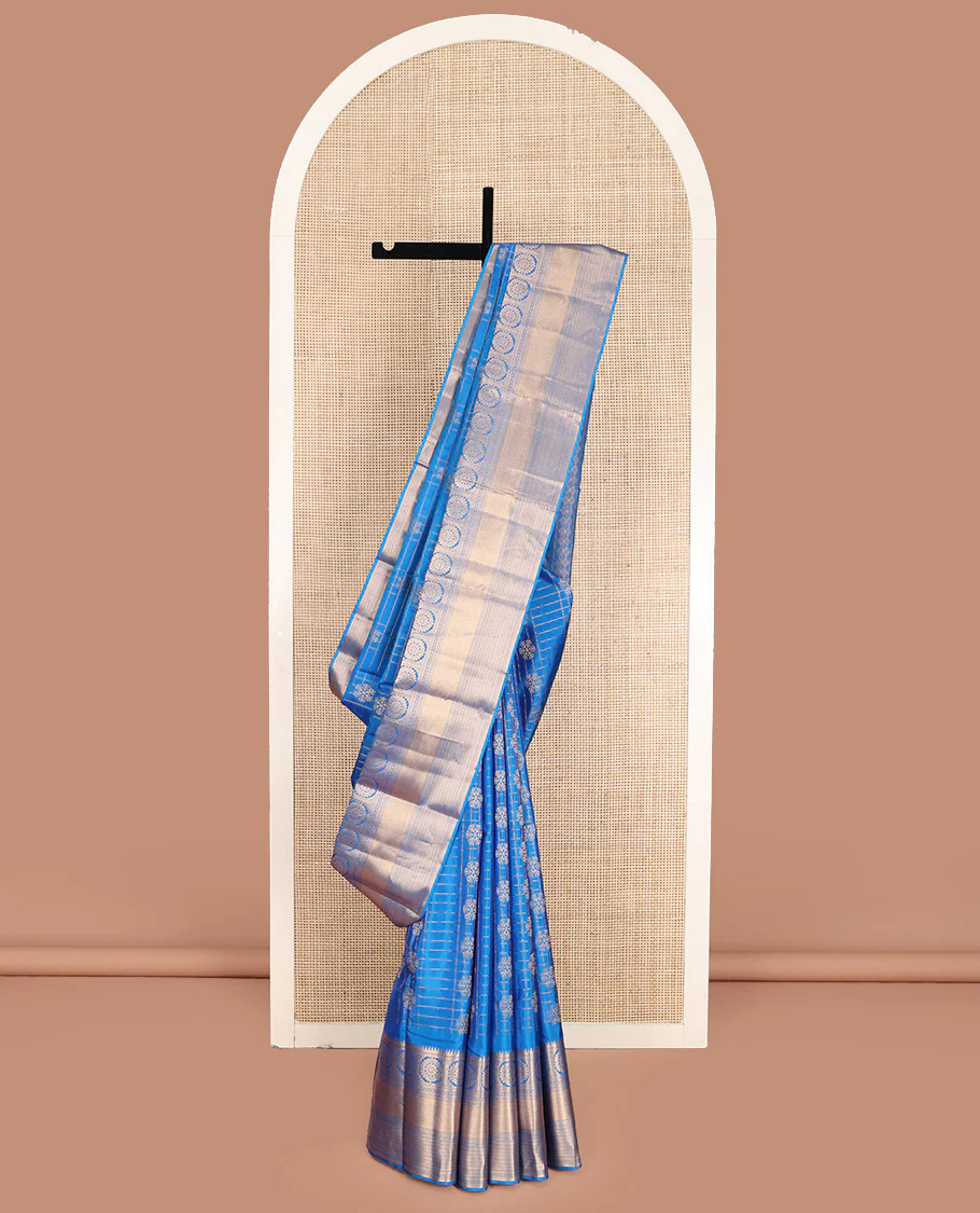 Blue Vasundhara Lite-Silk Mix Saree, Artfully Woven with Snowflake Buttas Enclosed Checks, Highlighted by Zari Border of Rekku, Chakram, Kathir, and Diamond Designs, Gleaming Jaal Pallu, and Paired with a Matching Blouse