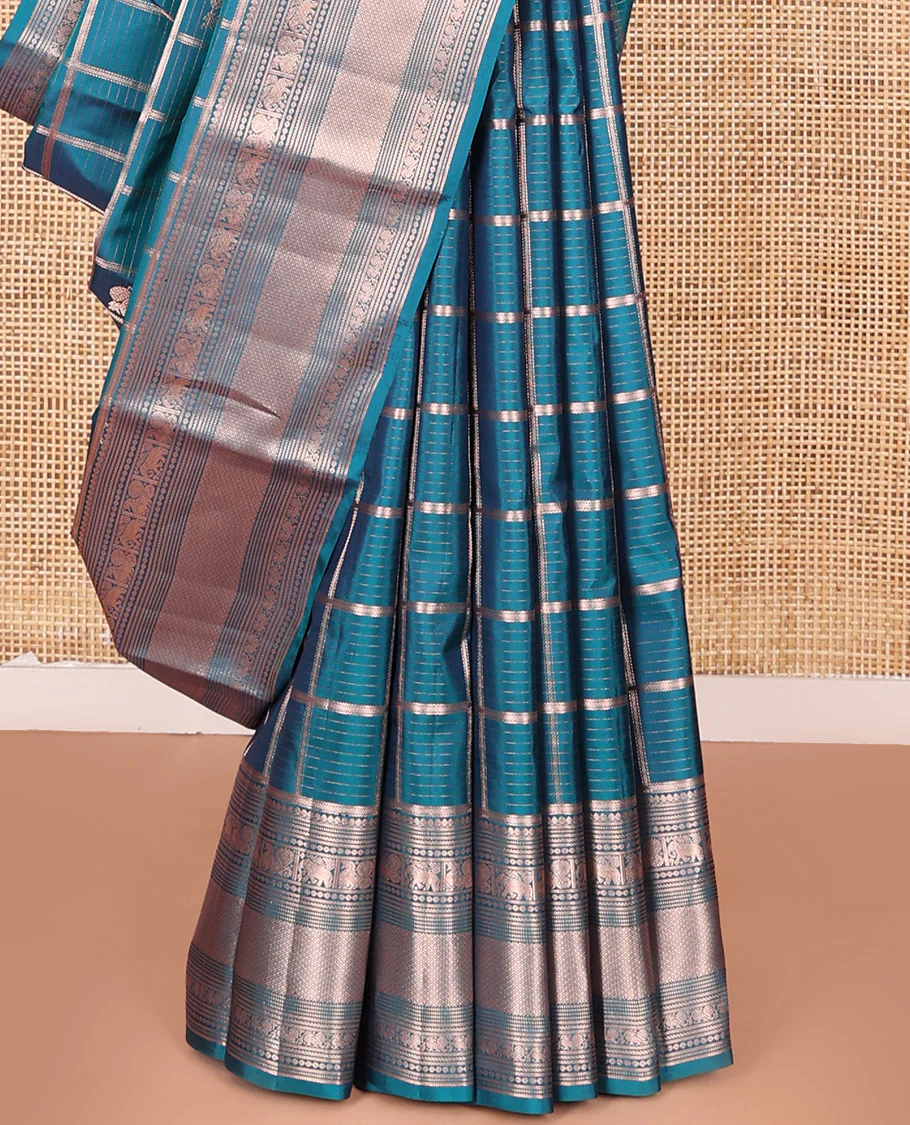 Blue Vasundhara Silk Saree Beautifully Bedecked with Medium Zari Checks, Highlighted by a Zari Border of Salngai, Mayil, Yaanai, Muthu, and Mayil Kann Designs, Delicately Woven Pallu, and Paired with a Matching Blouse - Image 4