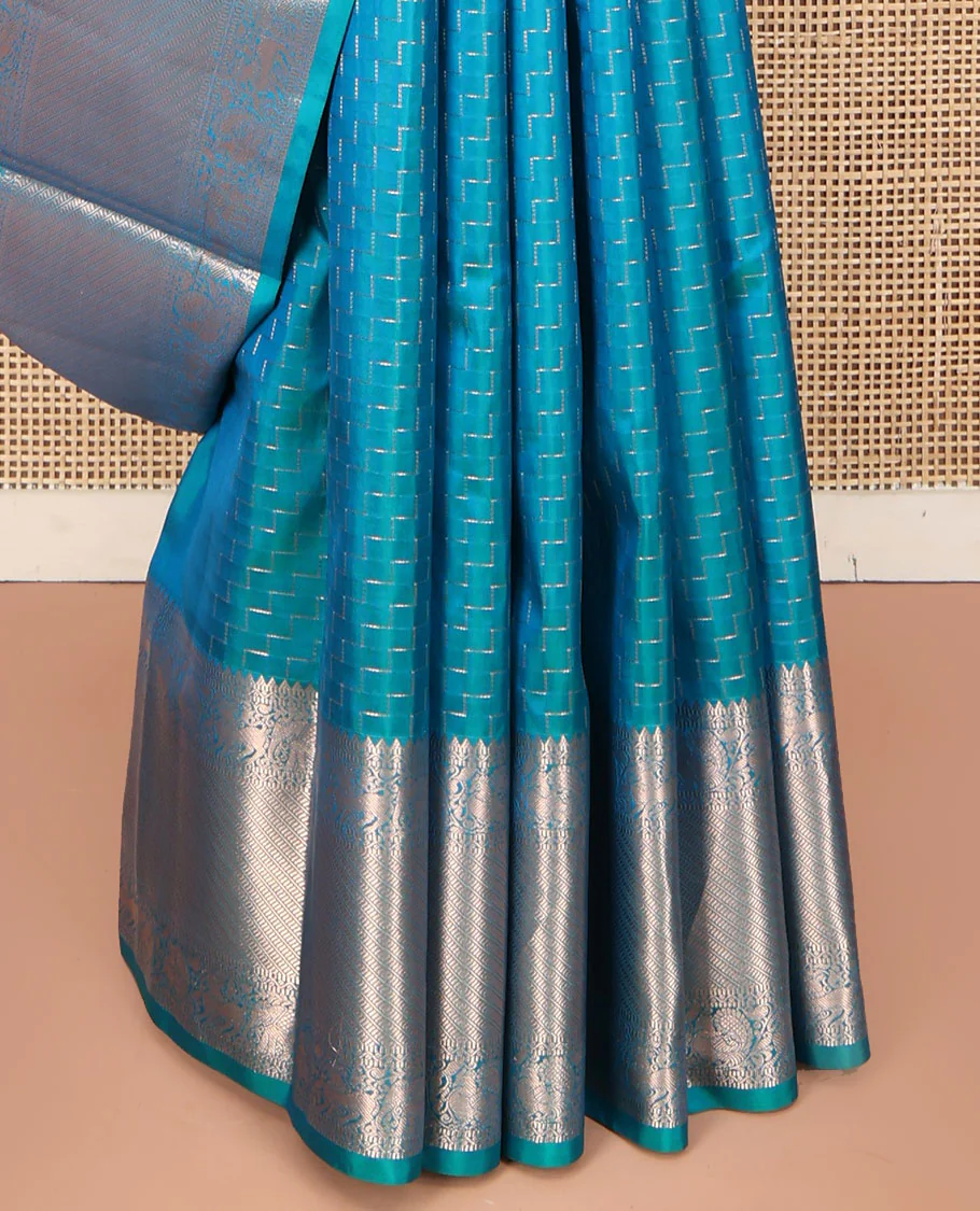 Blue Vasundhara Silk Saree, Beautifully Bedecked with Zig-Zag Stripes All Over Its Body, Highlighted by a Zari Border of Rekku, Muthu, Neli, Mayil, and Yaali Designs, Grand Jaal Pallu, and Paired with a Matching Blouse - Image 4