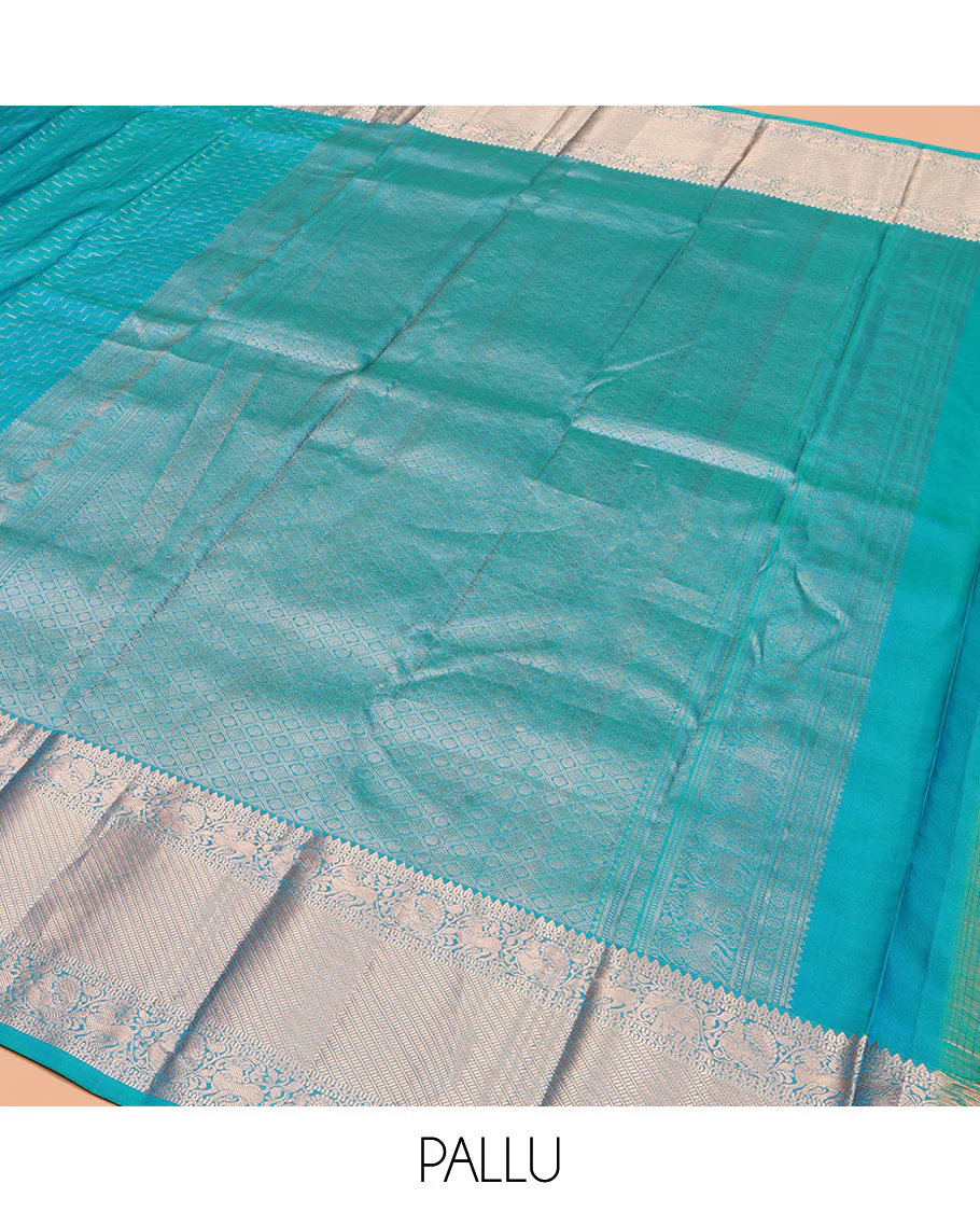 Blue Vasundhara Silk Saree, Beautifully Bedecked with Zig-Zag Stripes All Over Its Body, Highlighted by a Zari Border of Rekku, Muthu, Neli, Mayil, and Yaali Designs, Grand Jaal Pallu, and Paired with a Matching Blouse - Image 5