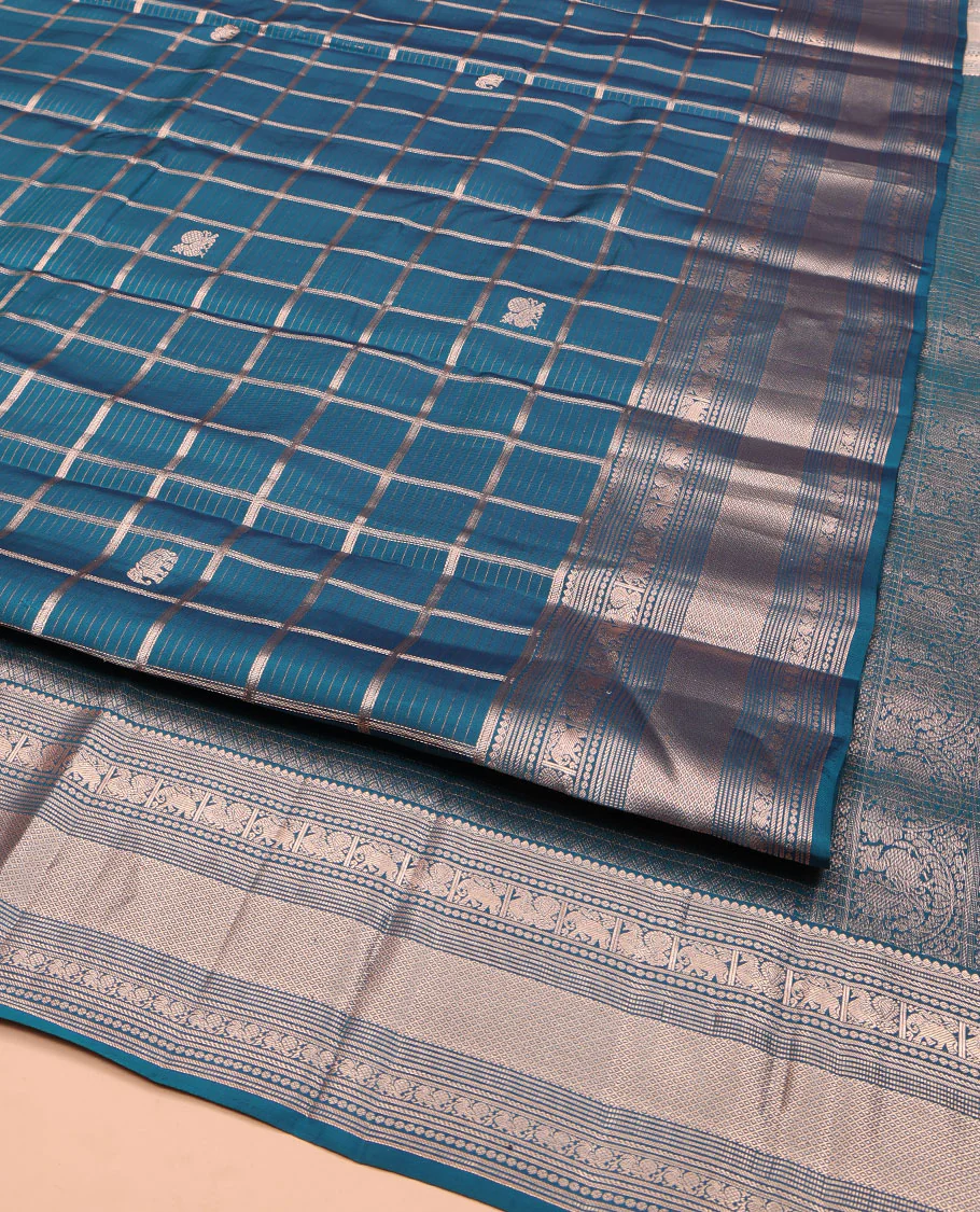 Blue Vasundhara Silk Saree, Enriched with Zari Butta Enclosed Checked Design All Over Its Body, Highlighted by Zari Border of Thilakam Mokku, Muthu, Mayil, Yaanai, and Mayil Kann Designs, Grand Jaal Pallu, and Paired with a Matching Blouse - Image 2